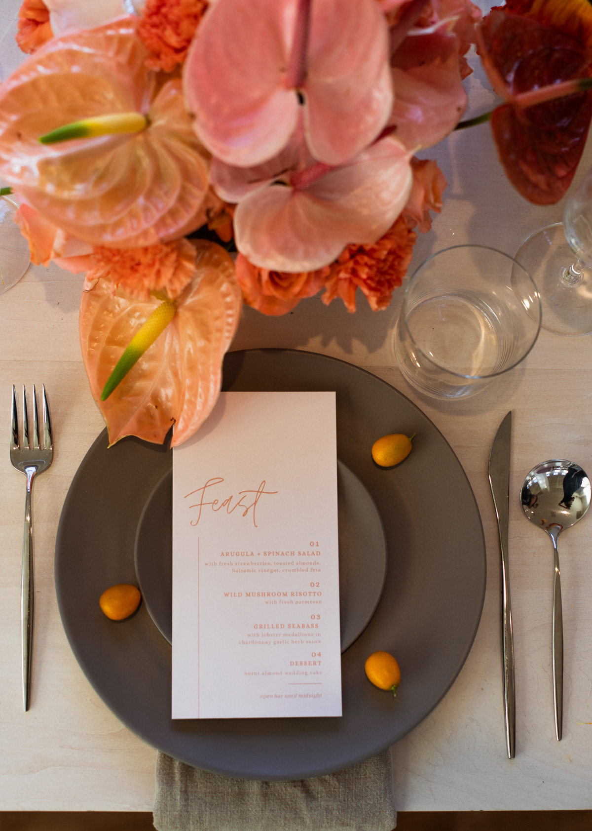 Elegant table setting with floral centerpiece and menu card