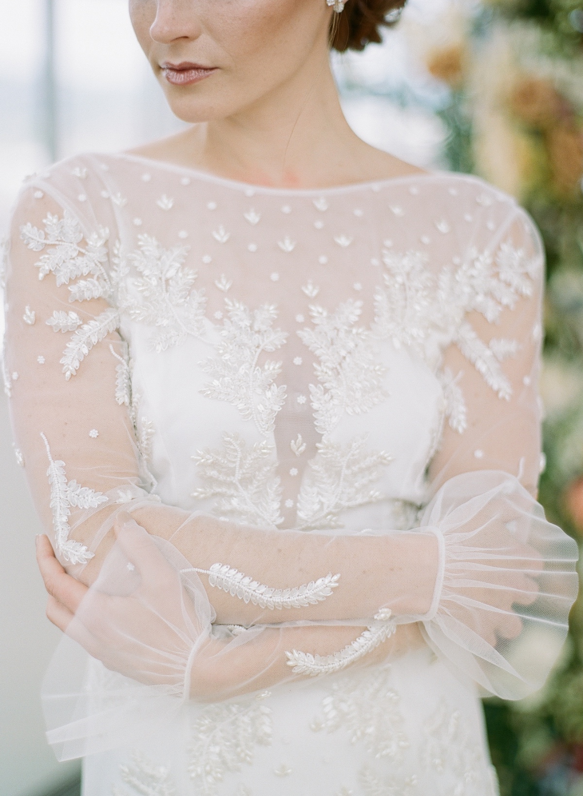 long sleeve lace wedding gown with  ruffle accent around the wrists
