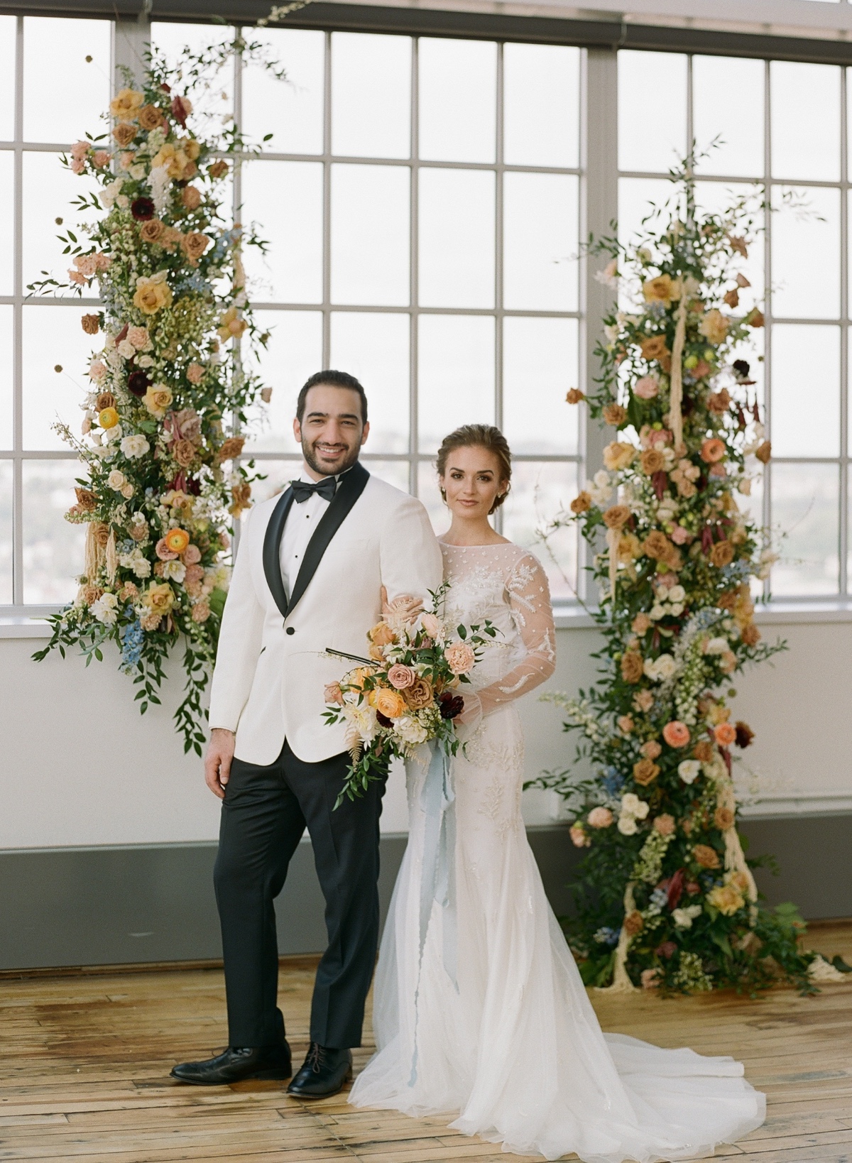 Flower wedding backdrop at warehouse wedding