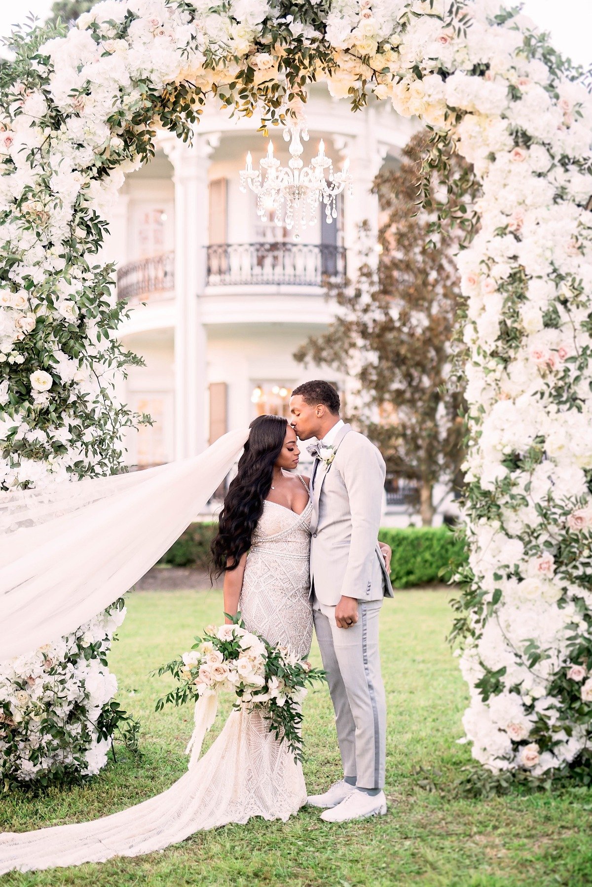white floral wedding arch