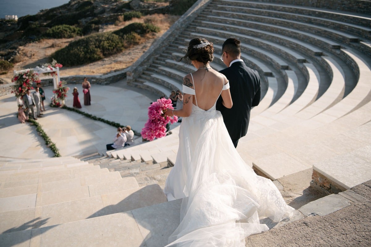 bride walking down the aisle at Greece ceremony site, theater of Odysseus Elytis