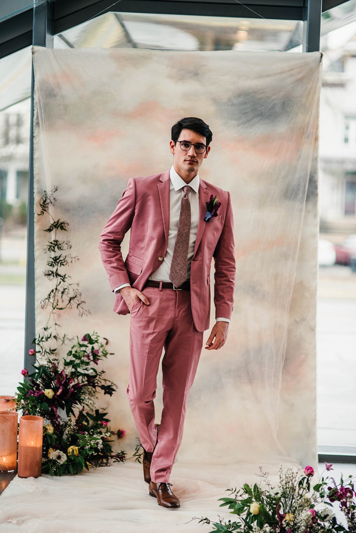 groom in blush suit
