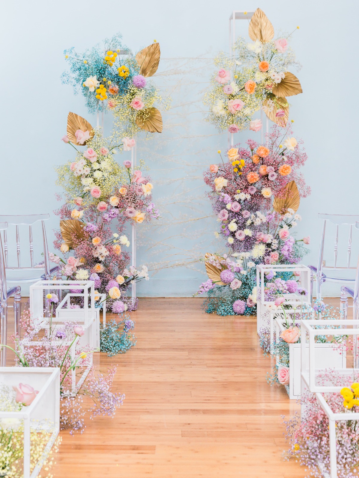 rainbow wedding backdrop made with dried florals