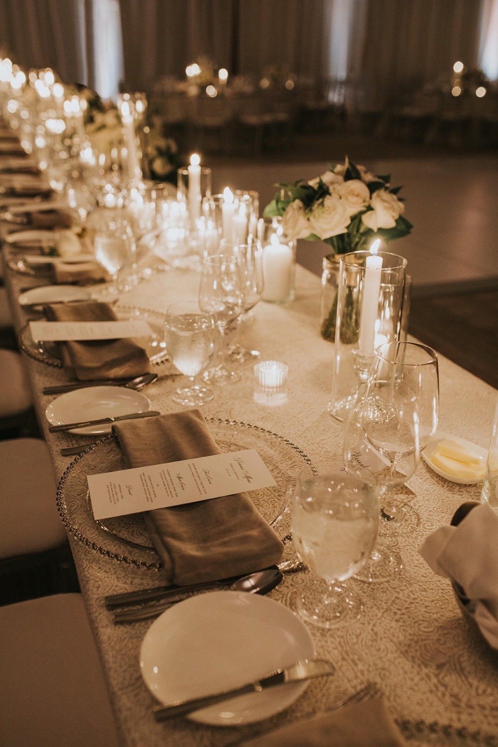 all white and beige candlelit wedding reception