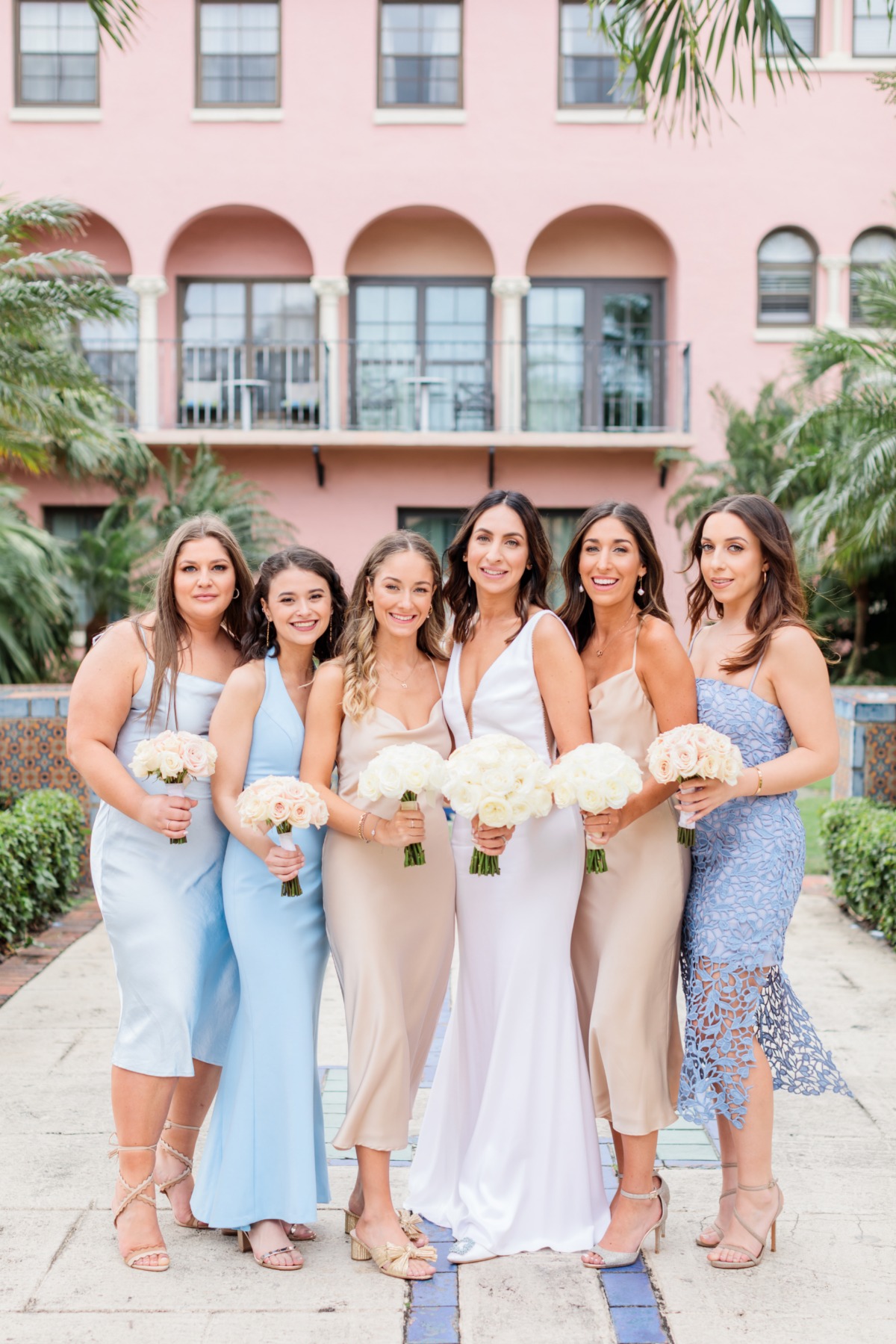 mismatched baby blue and nude bridesmaid dresses