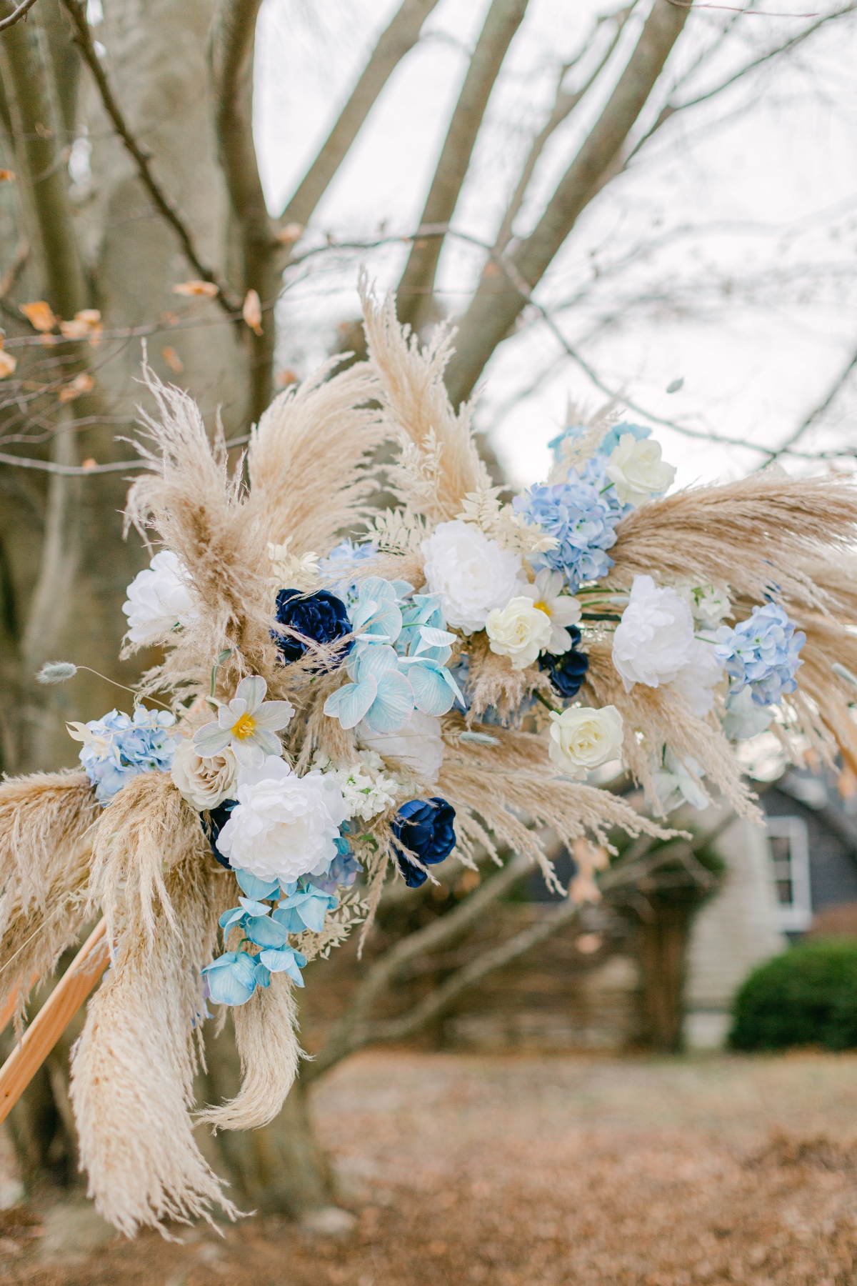 Pampas Grass and blue florals used in wedding backdrop