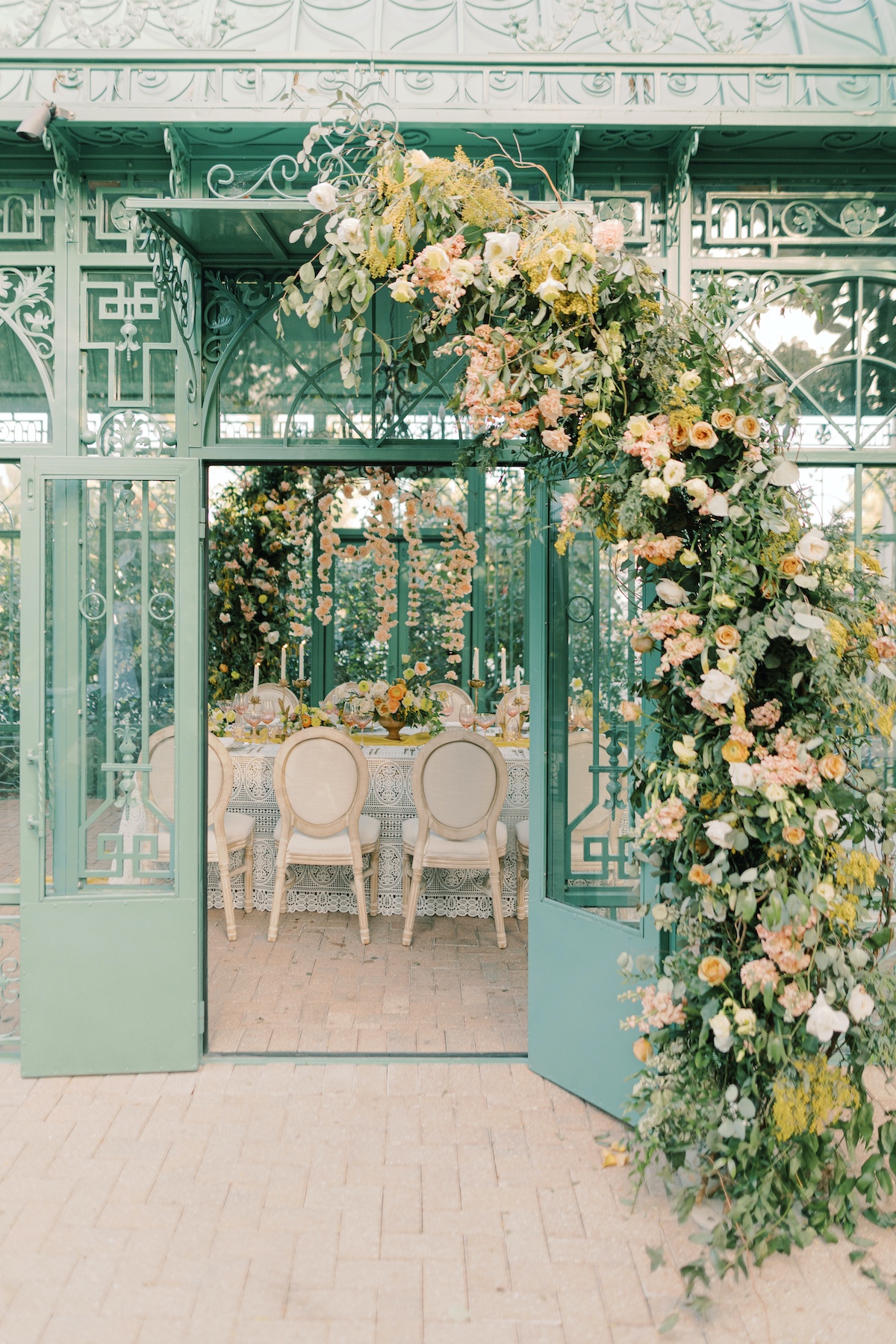 atrium wedding reception in peach, yellow and green