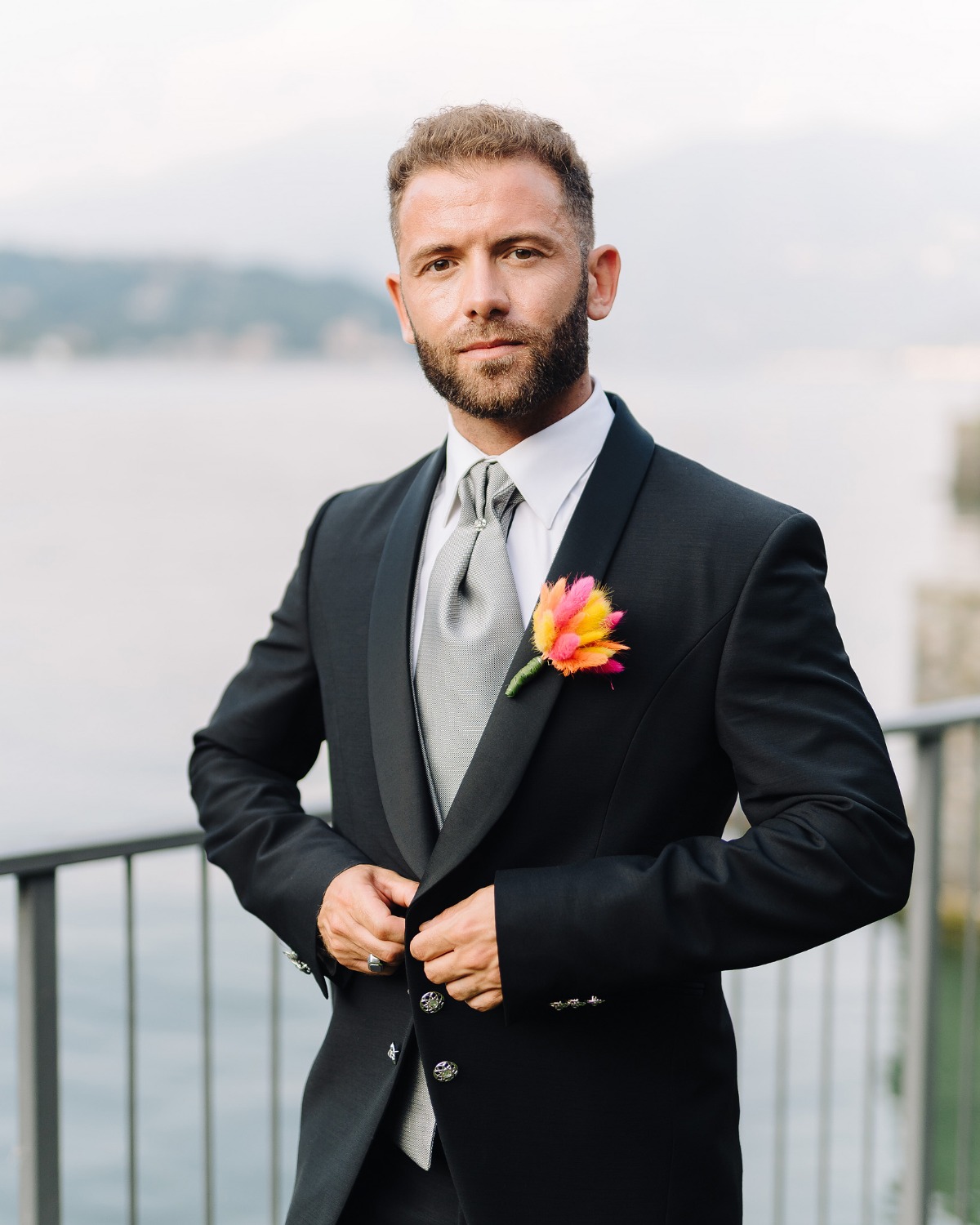 groom with a vibrant boutonniere 