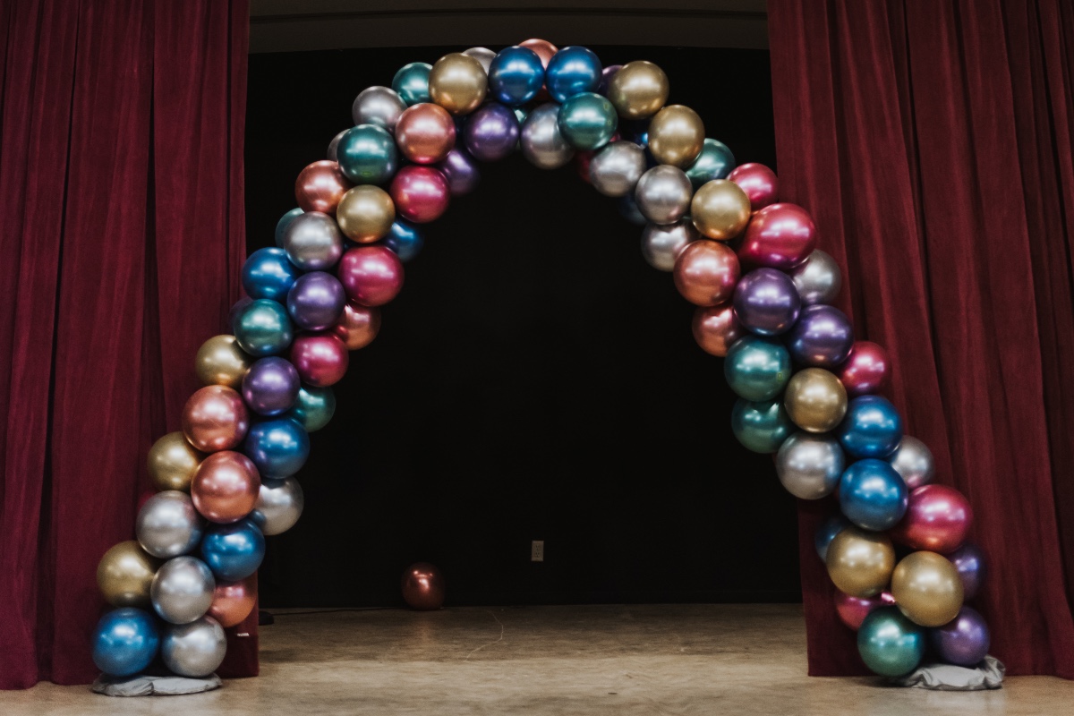 metallic balloon arch at wedding