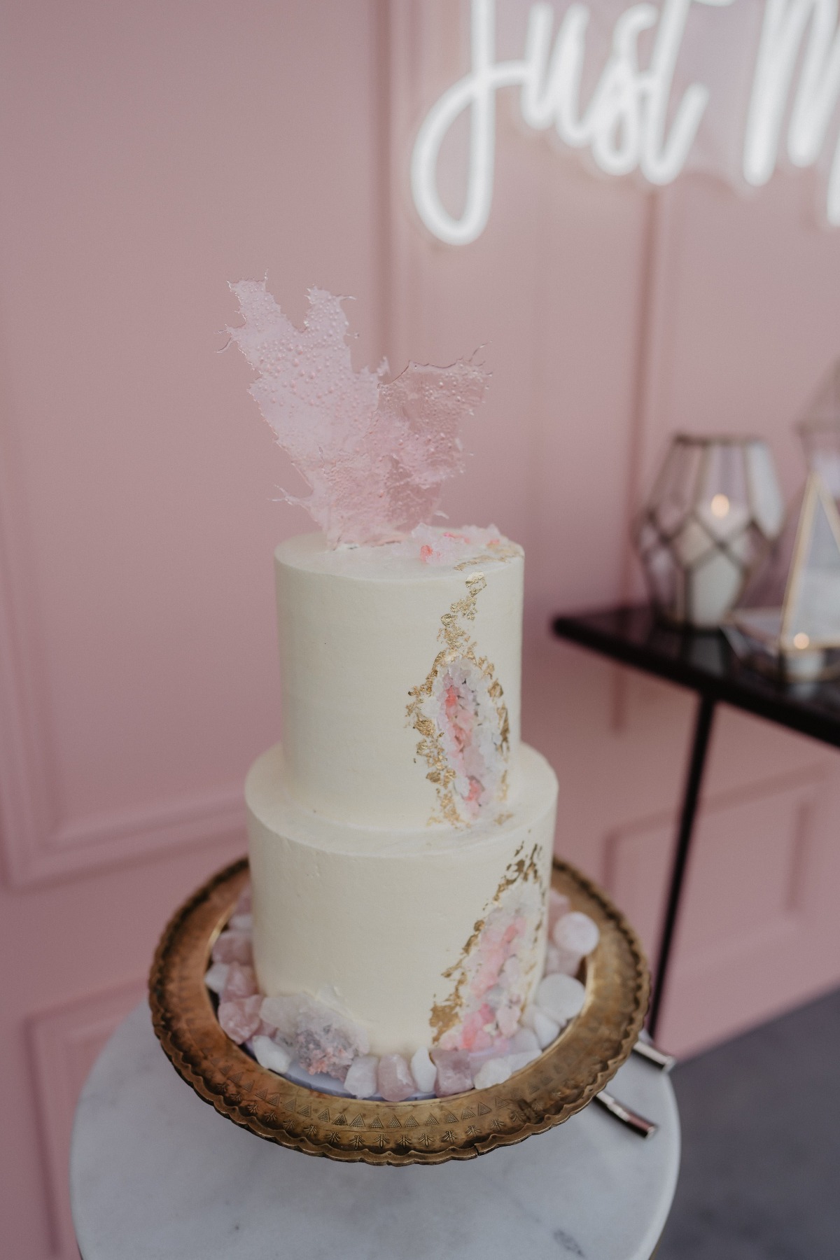 pink wedding cake on gold stand