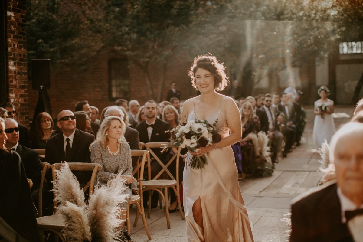 bridesmaid walking down the aisle