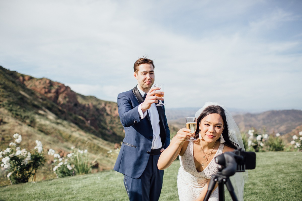 toasting their wedding via Zoom with their family