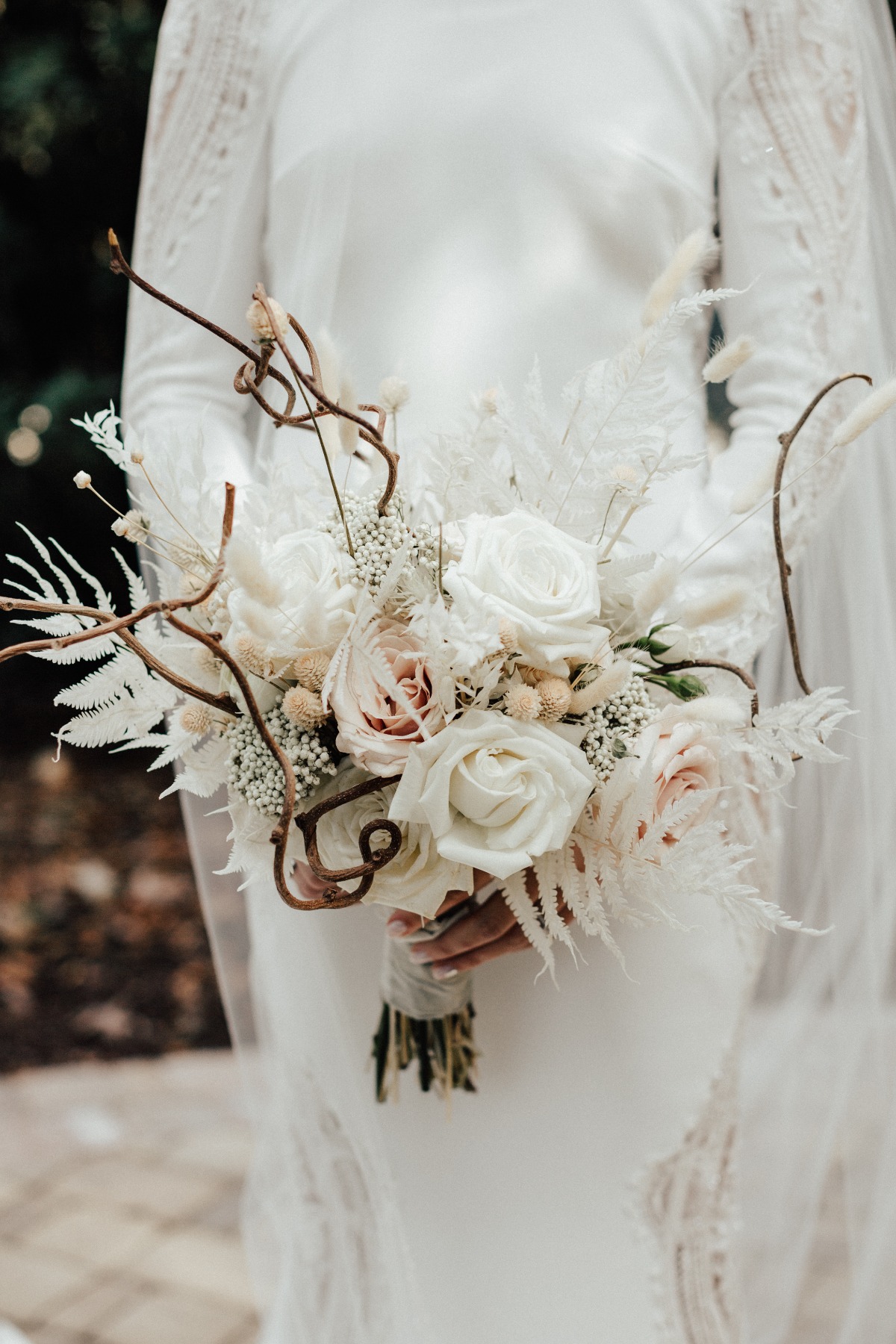 white wedding bouquet with fried florals and sticks