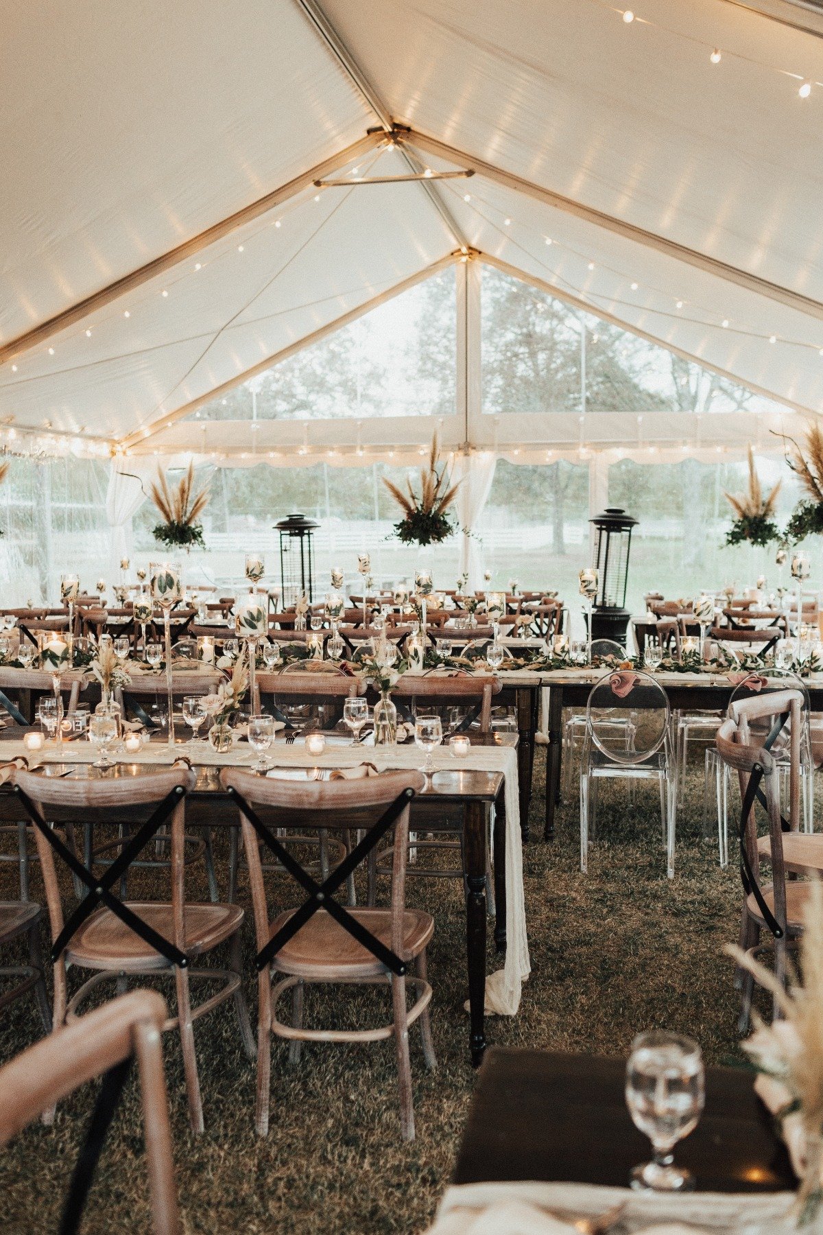 neutral wedding reception with pampas grass hanging arrangements