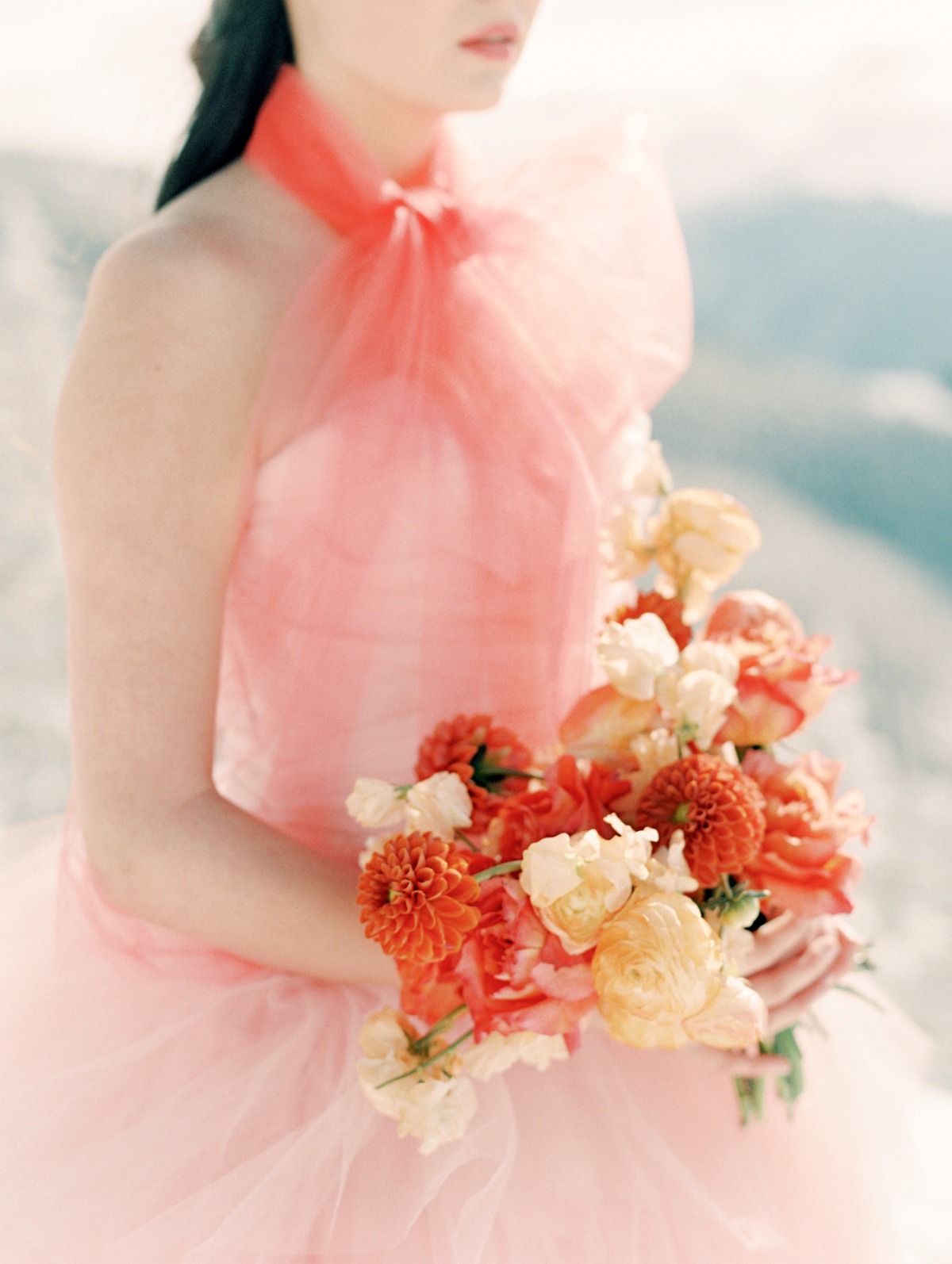 State and Arrow wedding bouquet in peach wedding gown