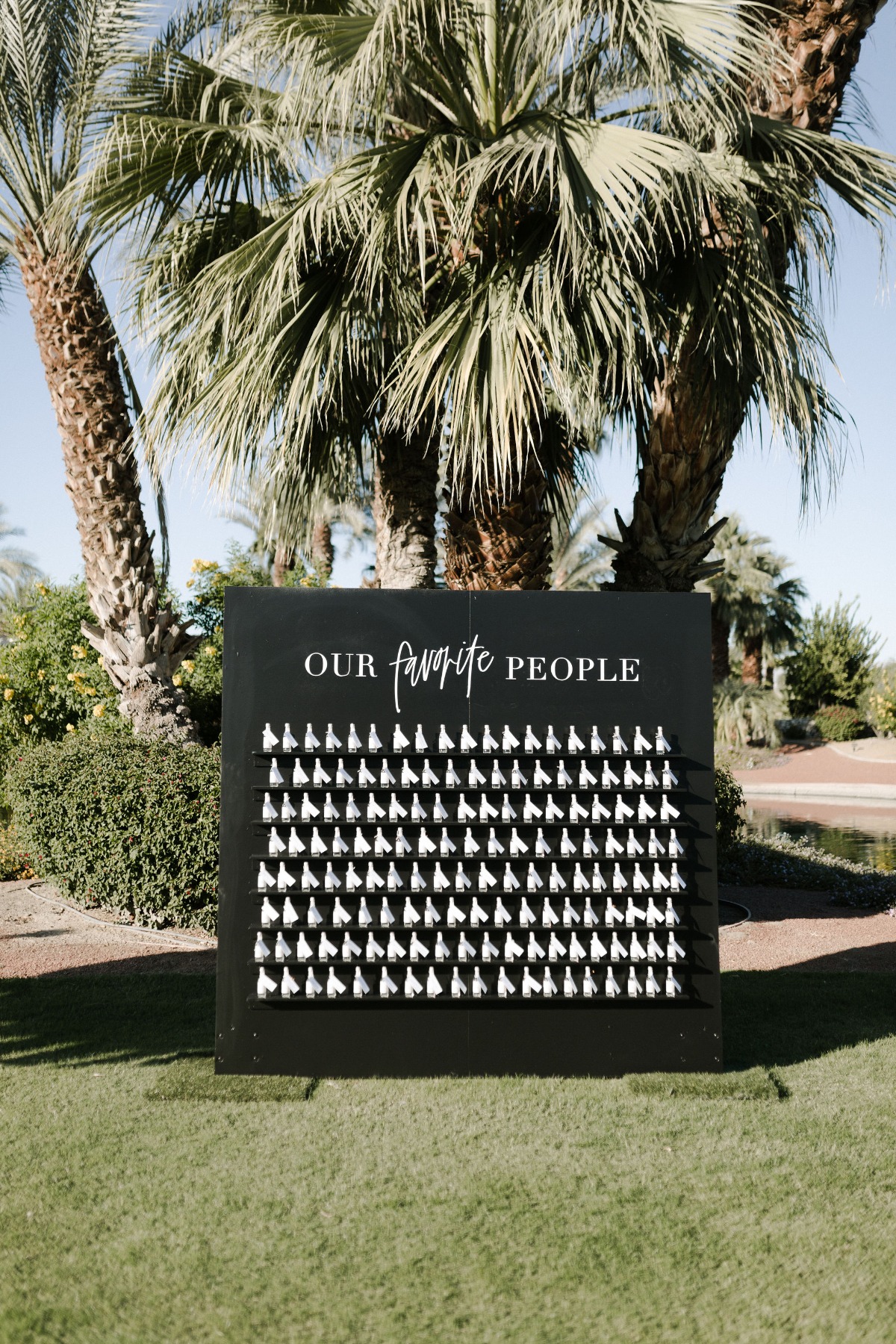 black and white seating chart with tiny bottles of alcohol