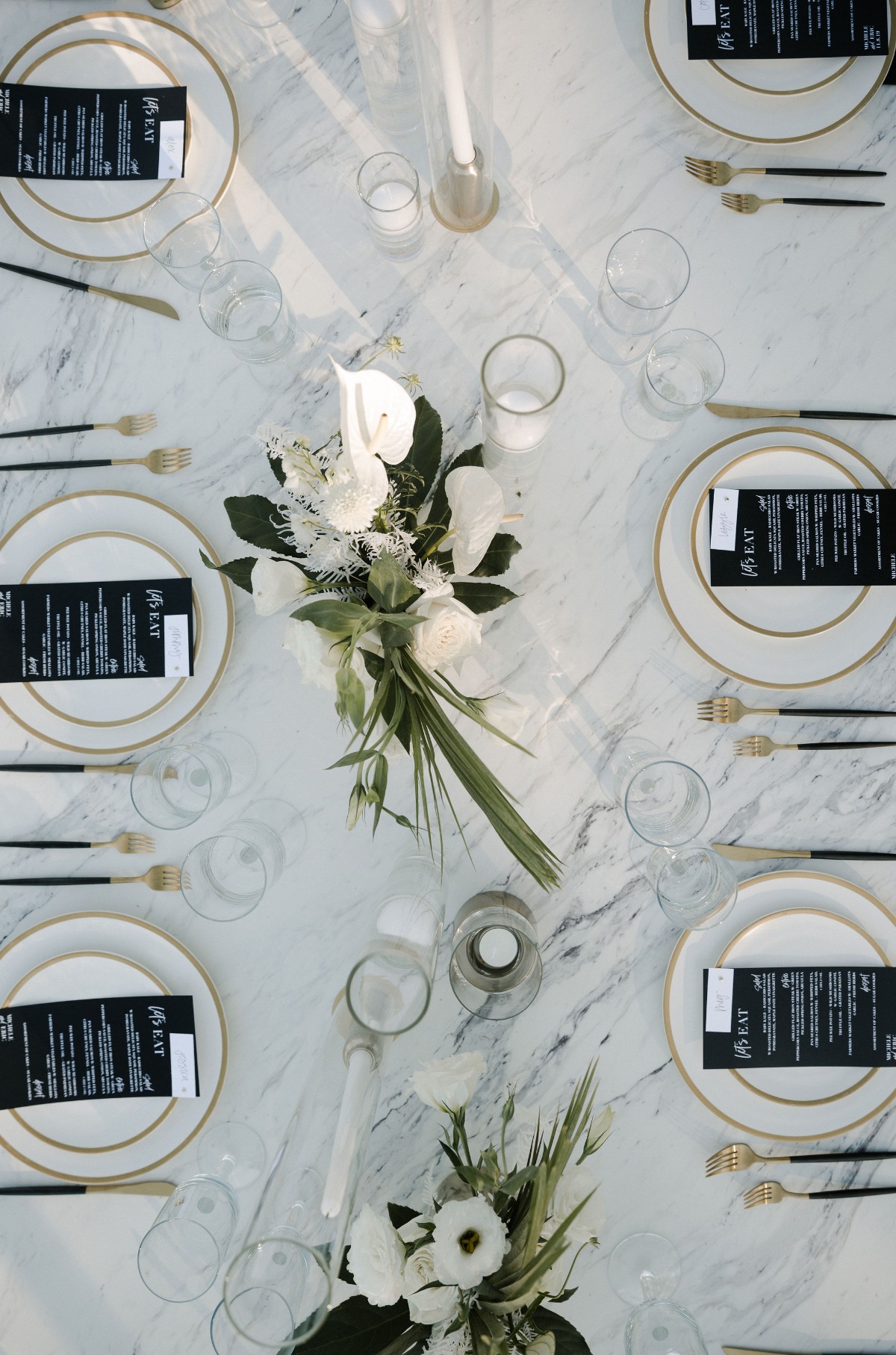 black and white wedding table decor with gold accents