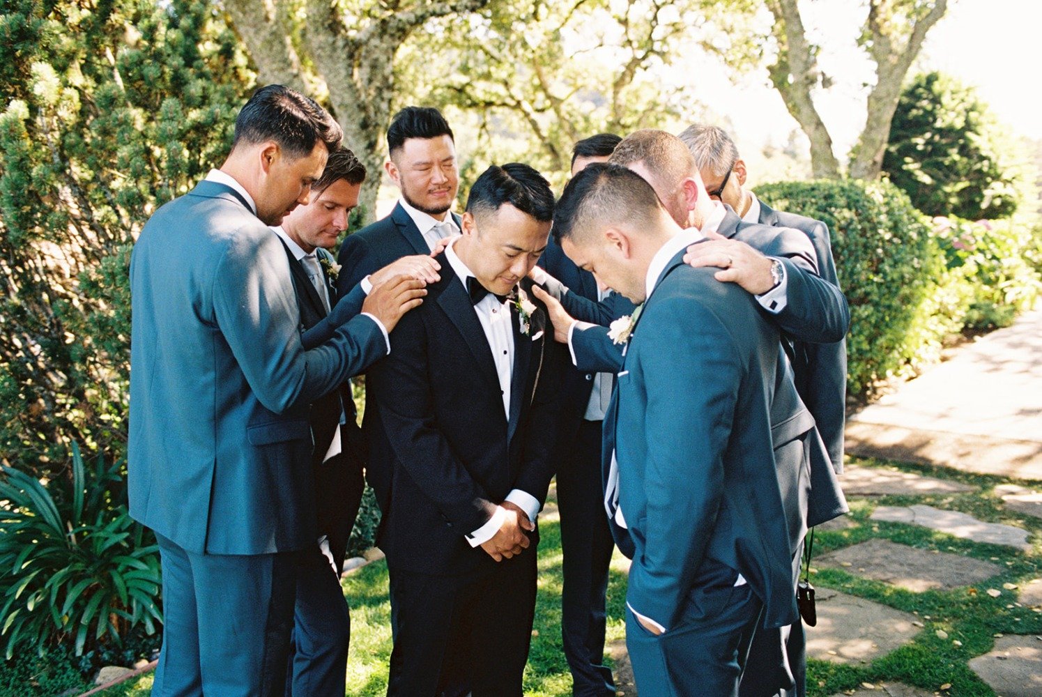groomsmen in blue suits