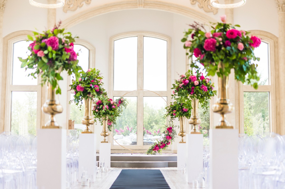 Elegant wedding ceremony decor with pink flowers