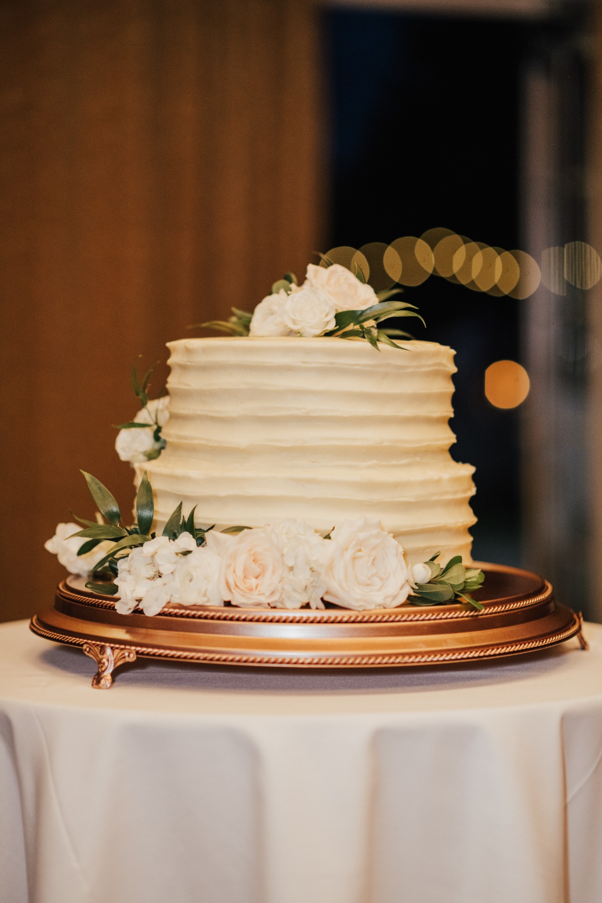 simple white wedding cake with flowers