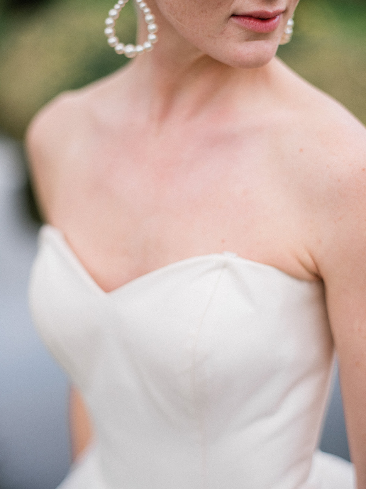 pearl wedding earrings on strapless dress