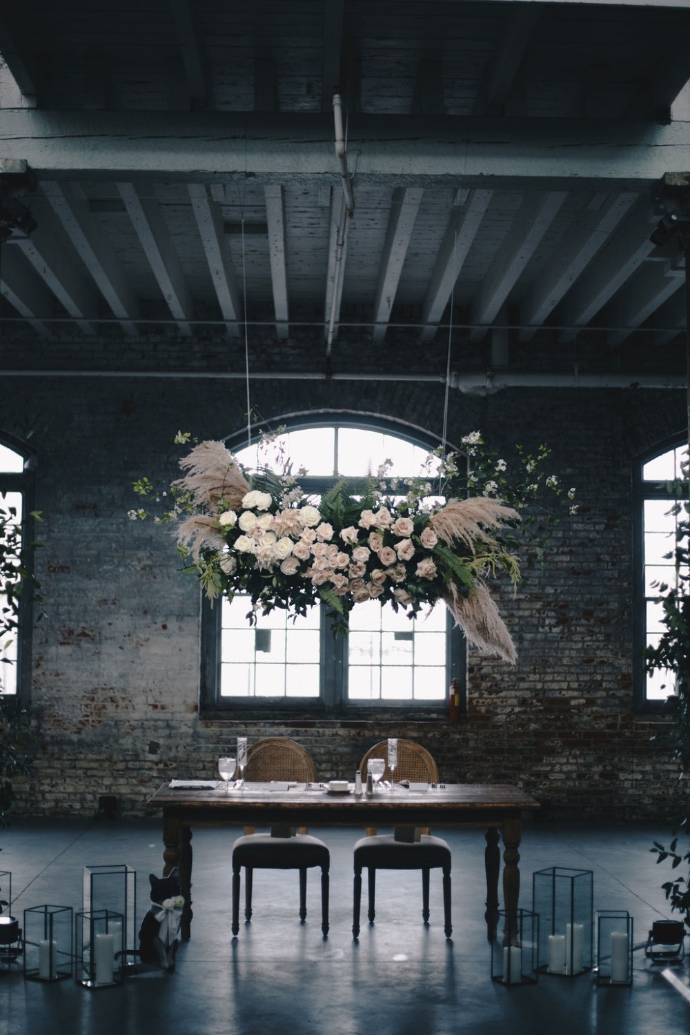 sweetheart table with hanging floral instillation