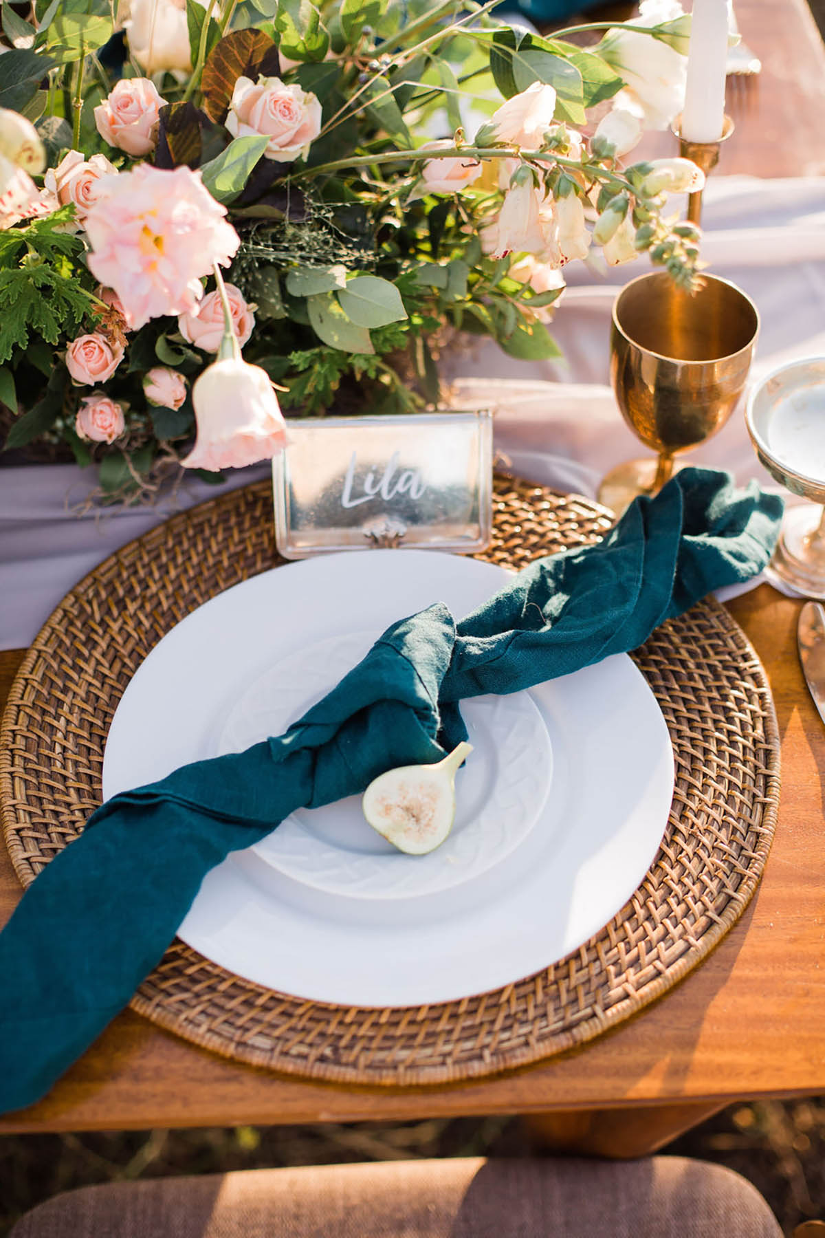 Elegant wedding table setting with flowers and fig