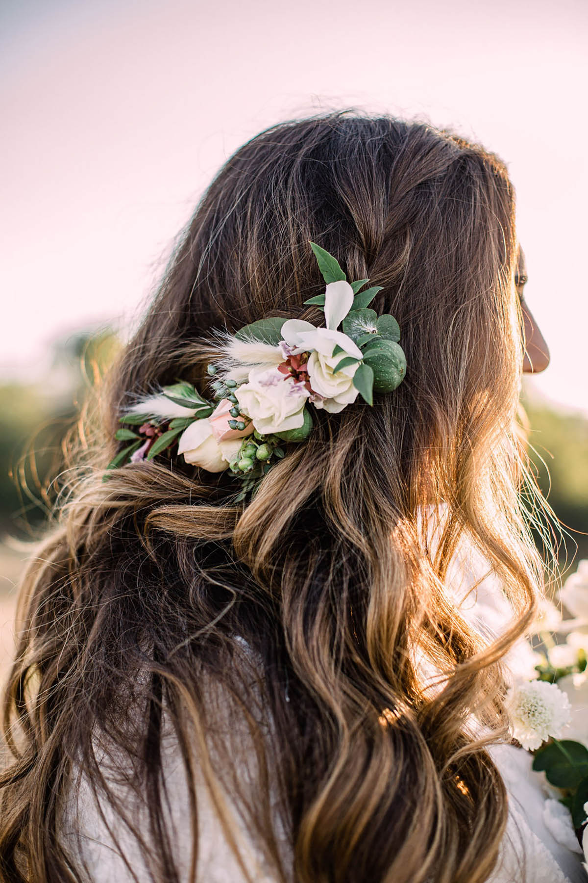 Bridal hair with flowers for a bohemian chic wedding look