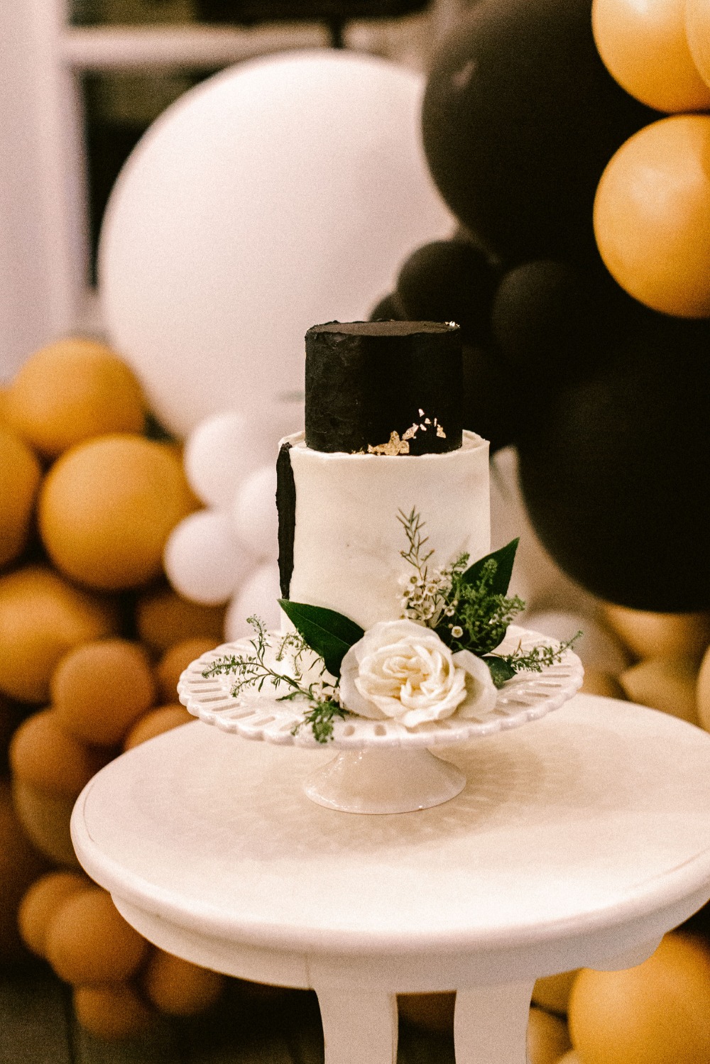 black, white and gold wedding cake