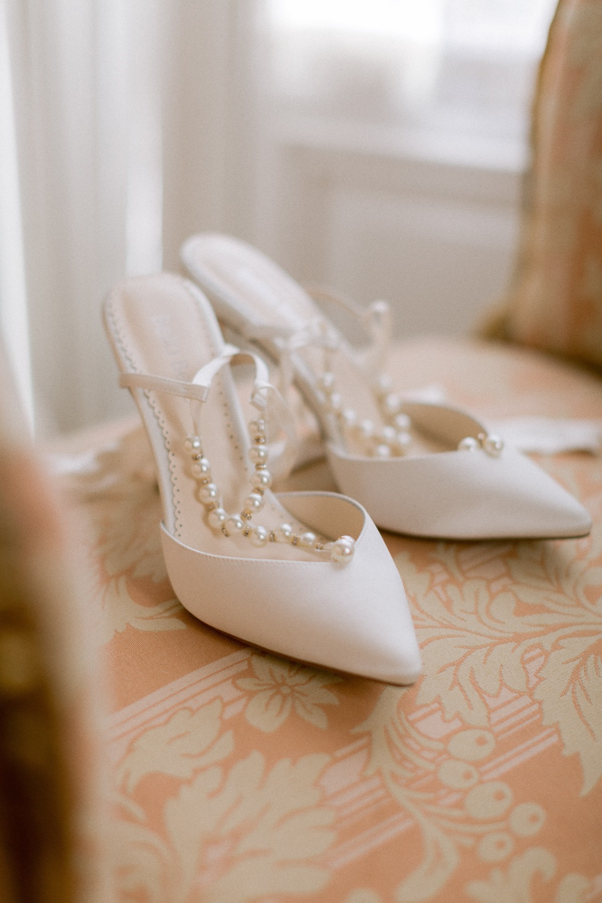 white wedding shoes with pearl straps