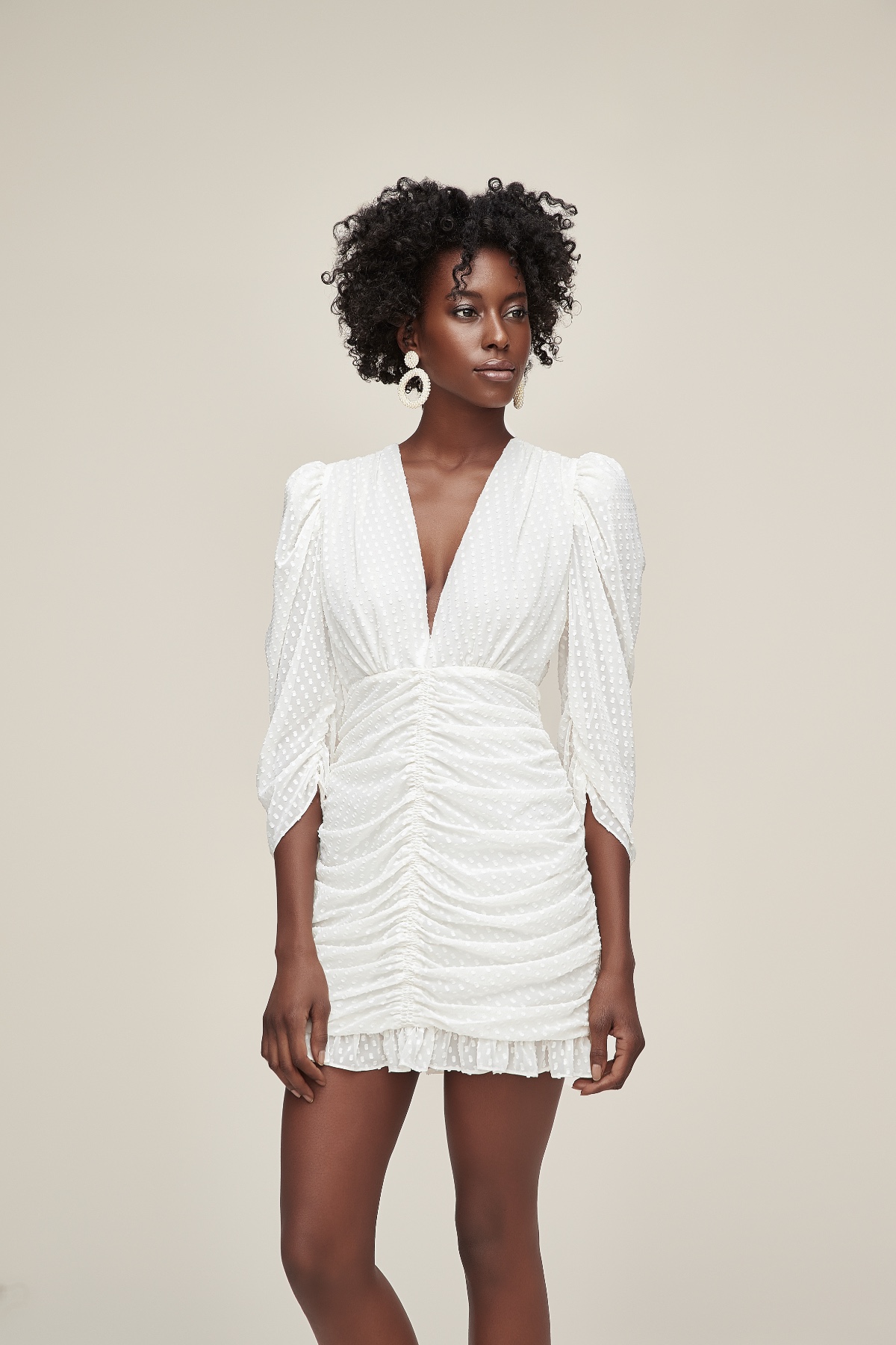 White eyelet mini dress with puff sleeves