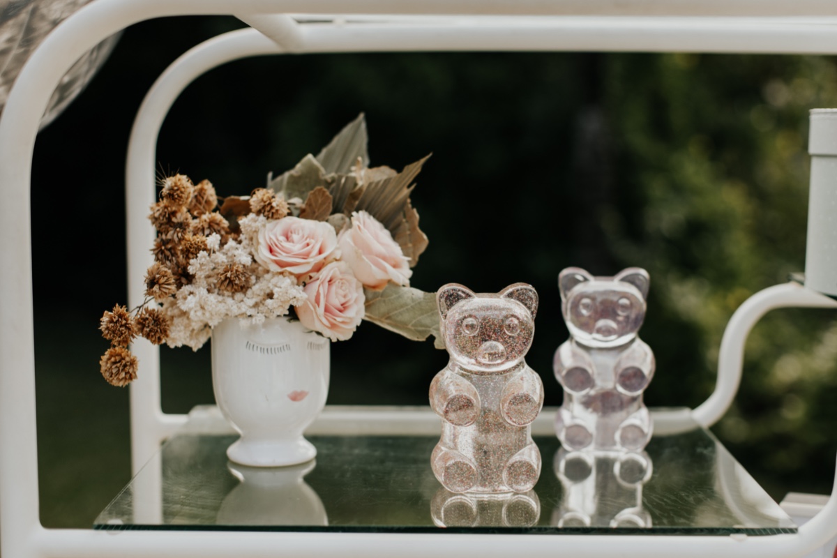 Pretty pink flowers and glittery gummy bears on a cart