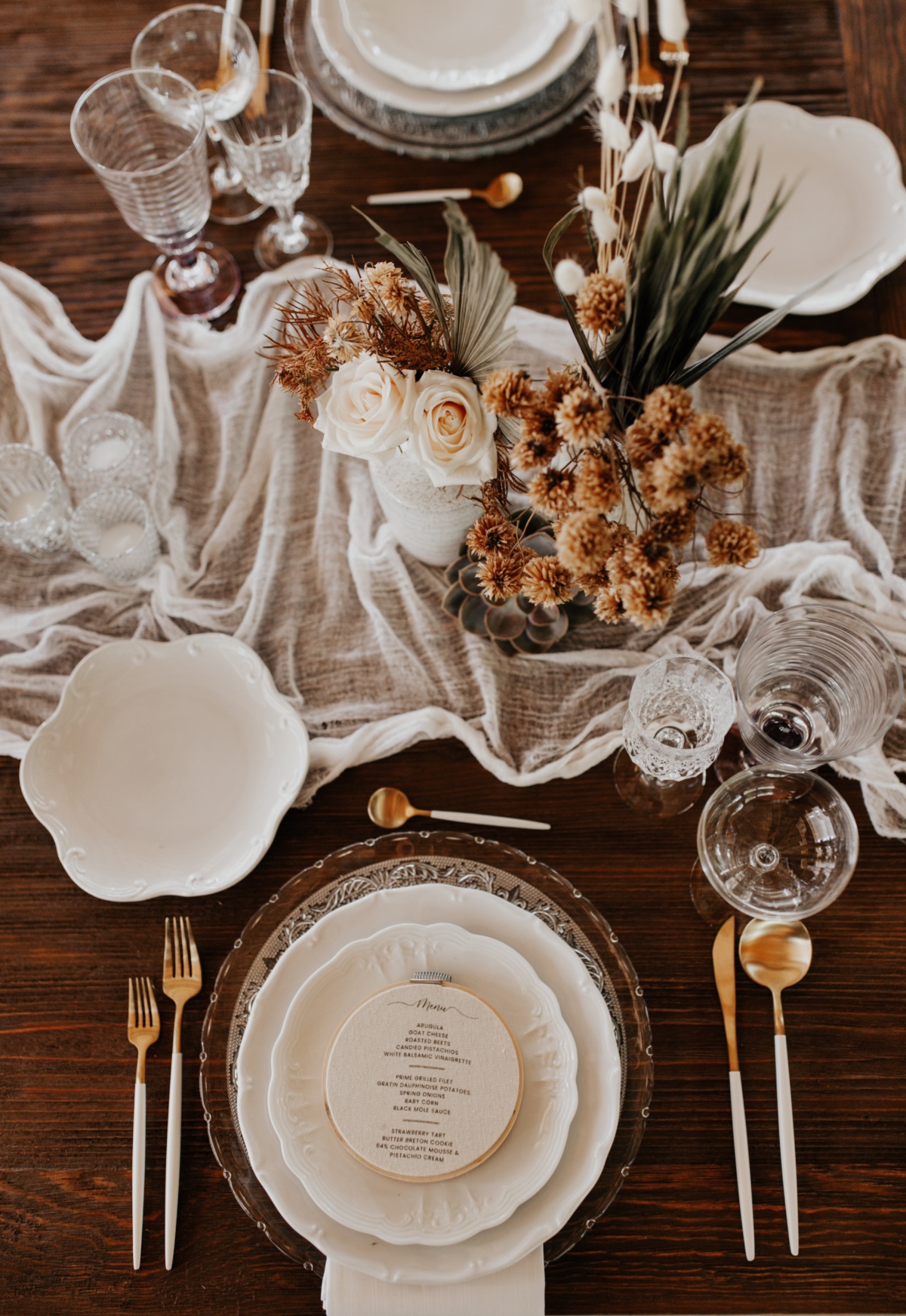 Elegant table setting with white floral centerpieces