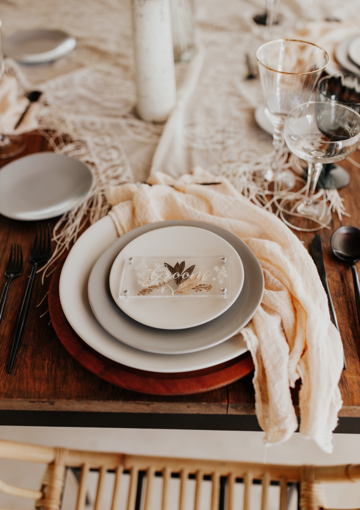 Elegant wedding place setting with neutral tones and decor