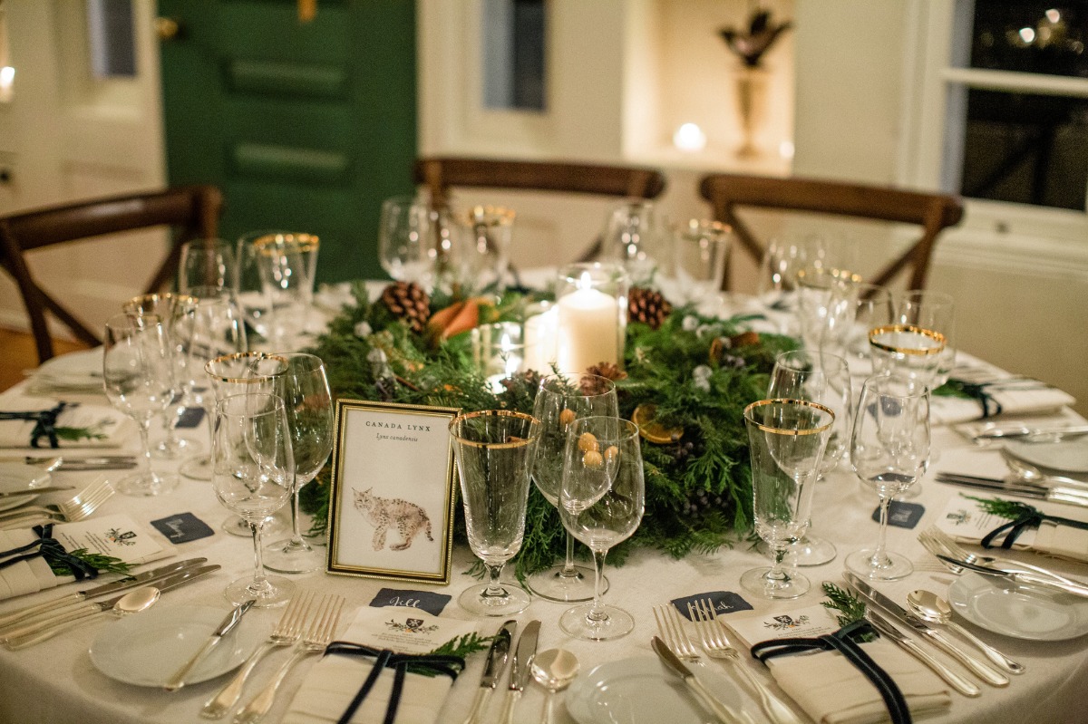 Elegant table setting with decorations and lynx artwork for a dinner