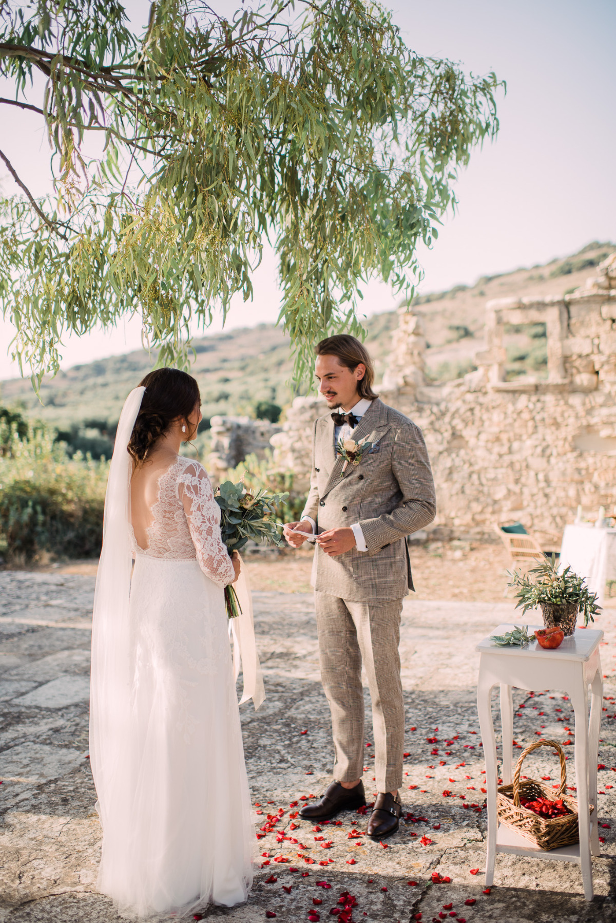 Bride and groom exchanging vows at outdoor wedding