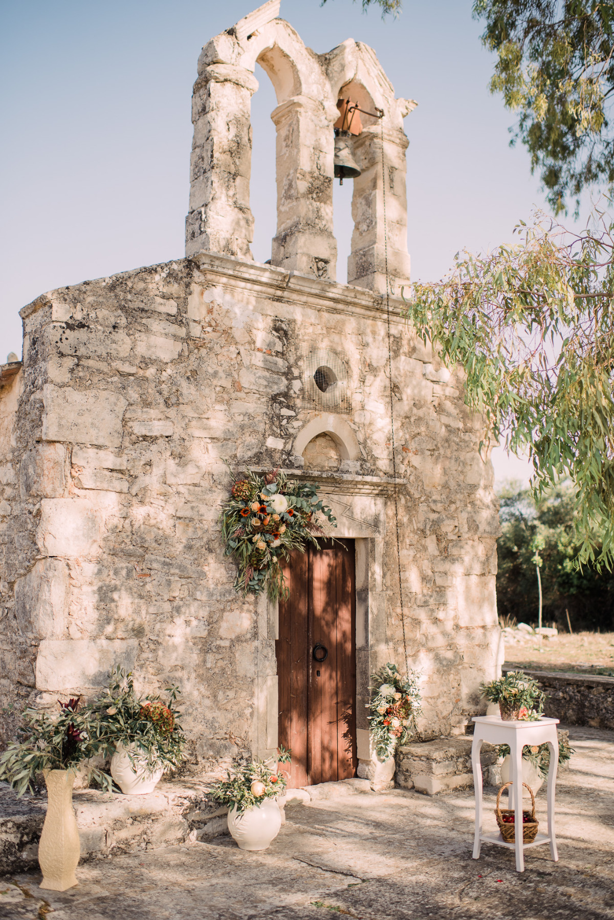Rustic stone chapel adorned with flowers for a wedding