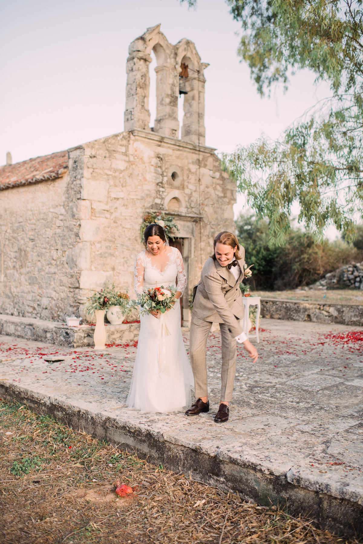 Happy bride and groom exiting rustic church wedding