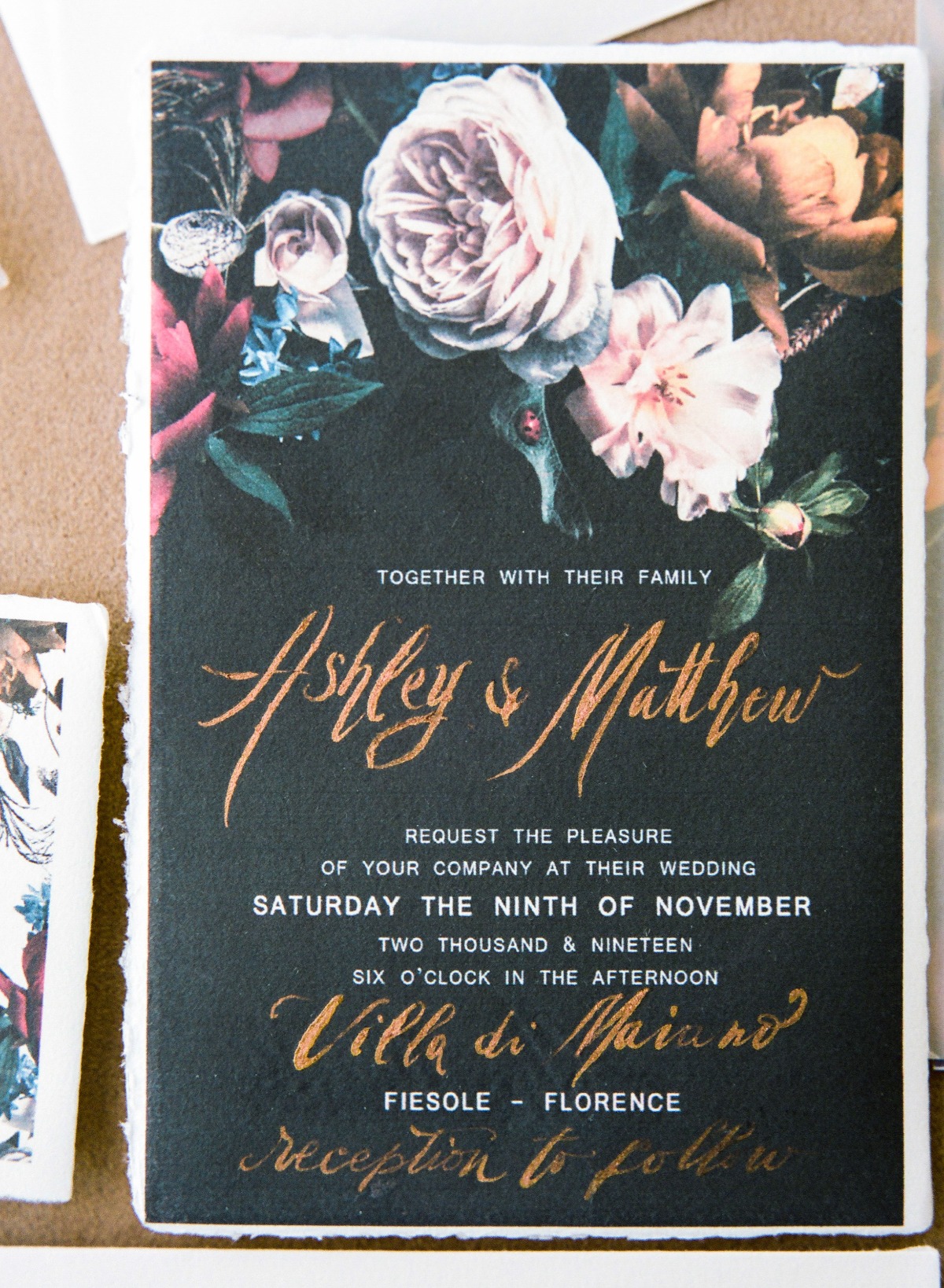 Elegant wedding invitation with floral design and calligraphy