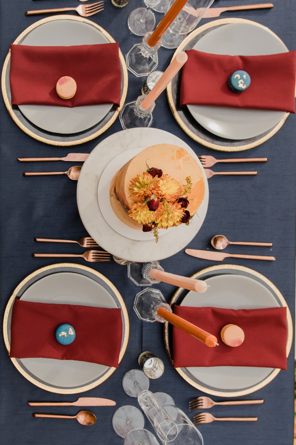 Elegant wedding table setting with cake and macarons