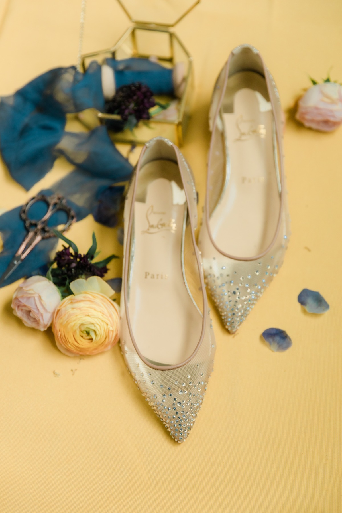 Elegant Louboutin bridal shoes with floral accents