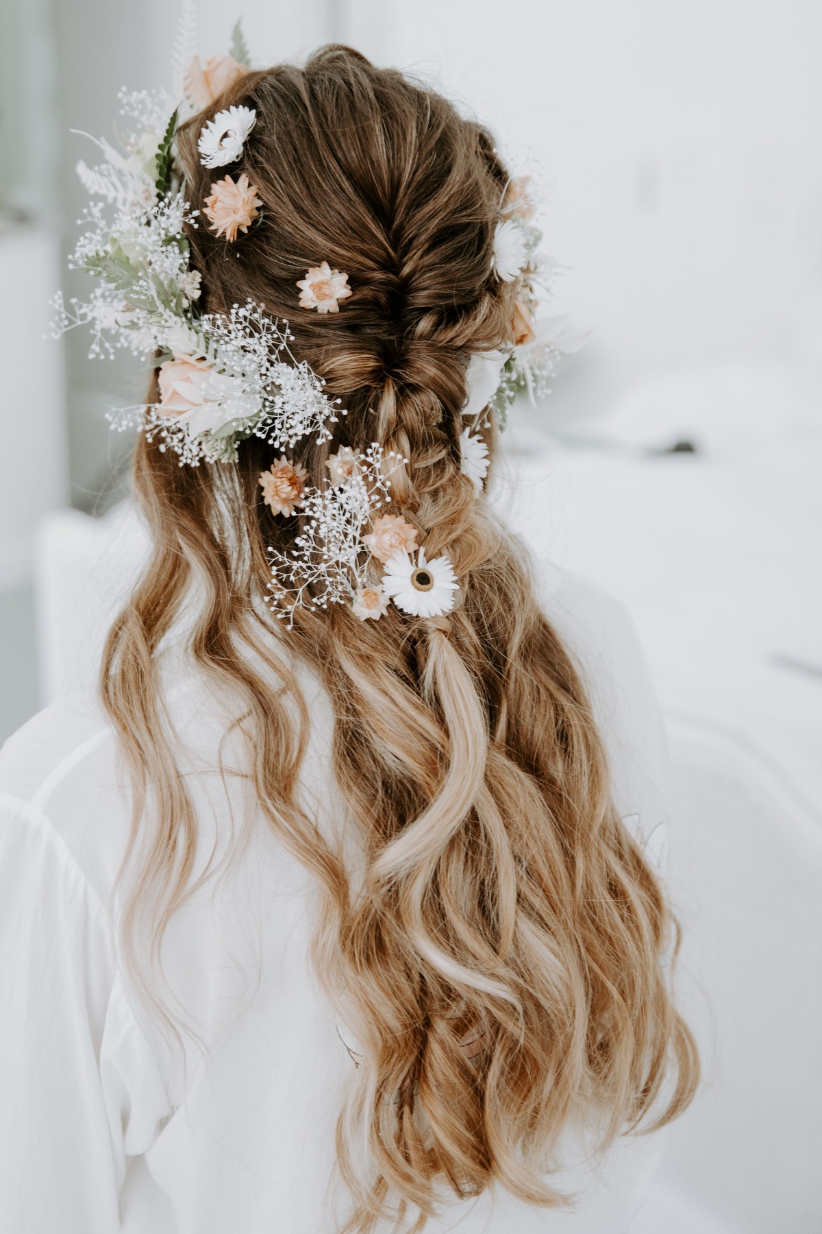 Braided hair with delicate flowers bridal hairstyle