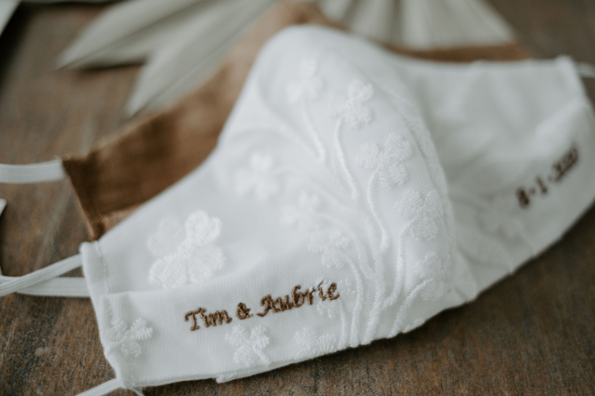 White floral wedding mask embroidered with Tim and Aubrie