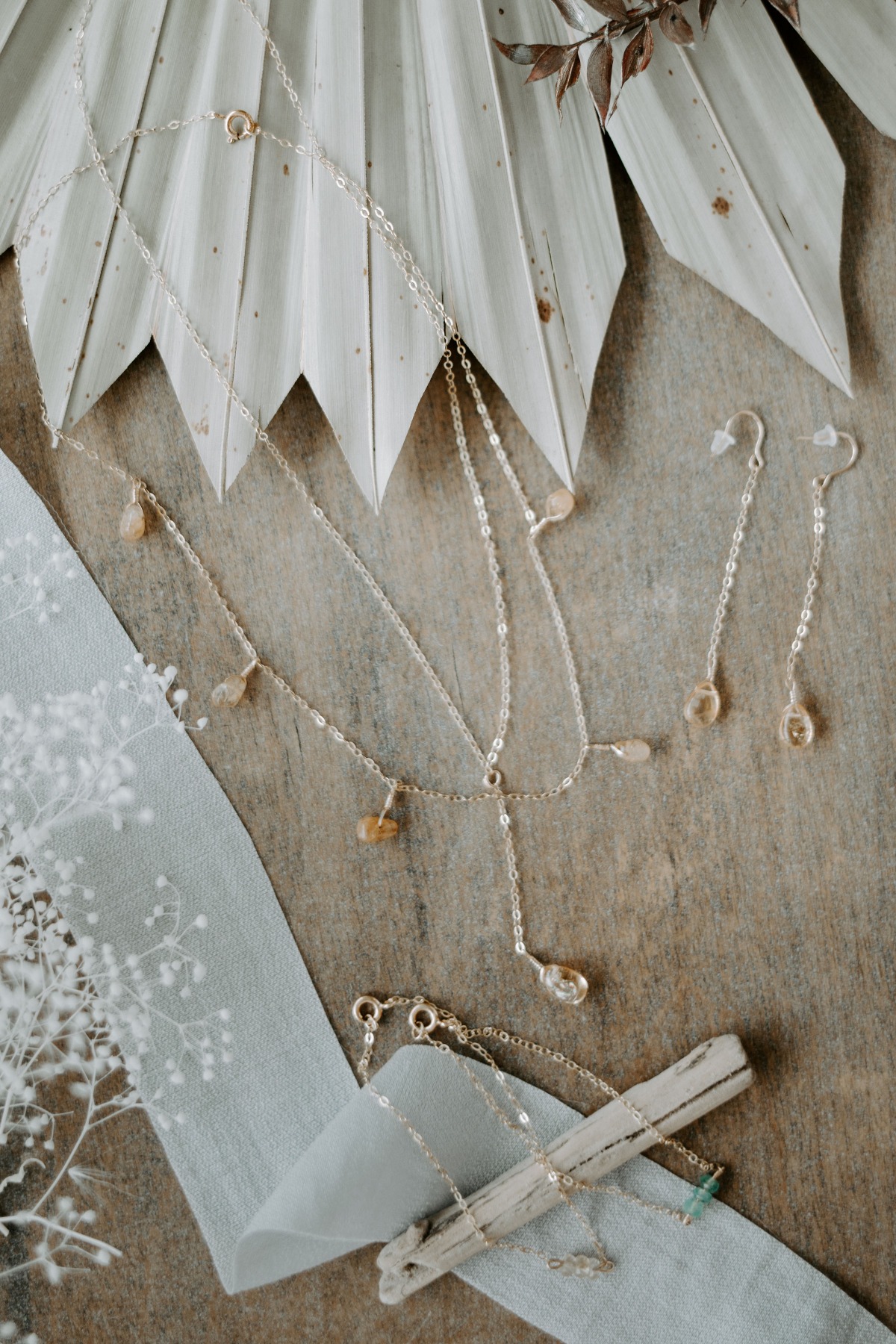 Delicate gold jewelry necklaces earrings and bracelet