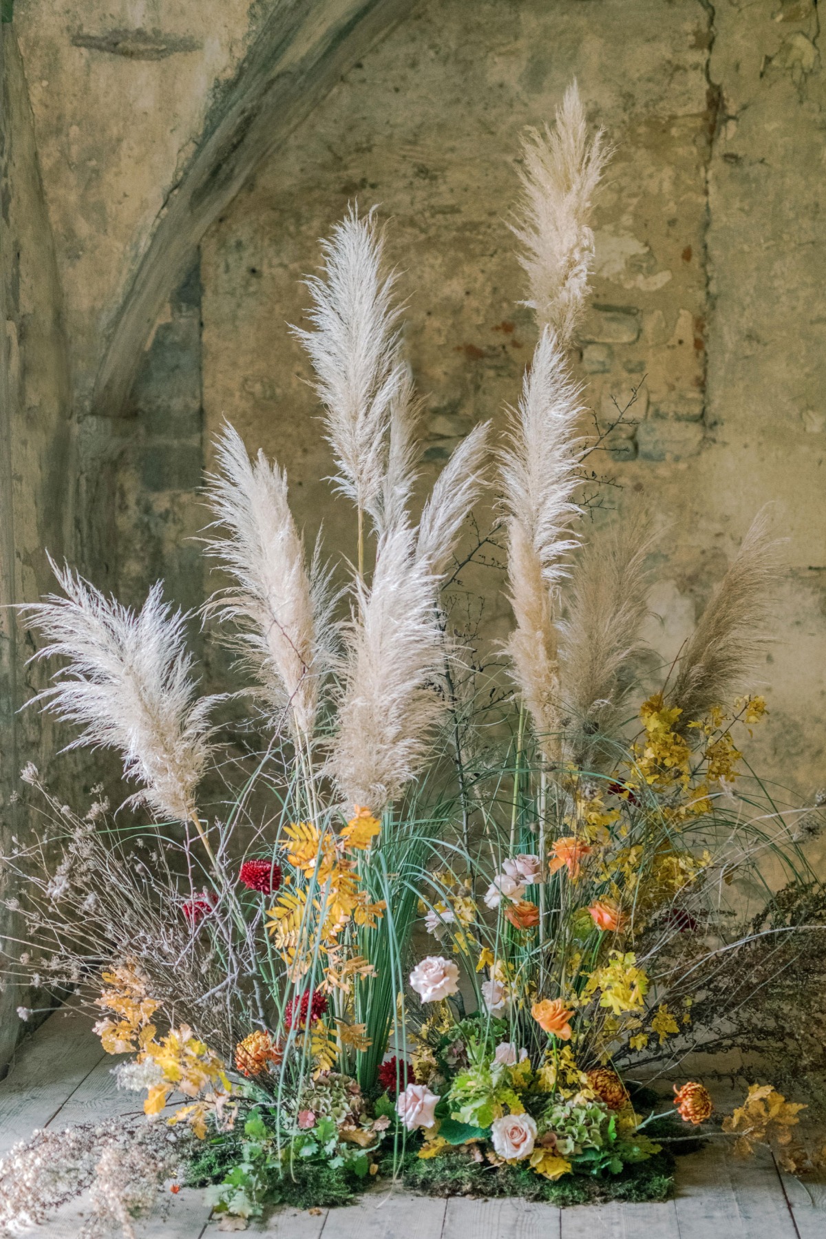 Elegant floral arrangement with pampas grass and vibrant blooms