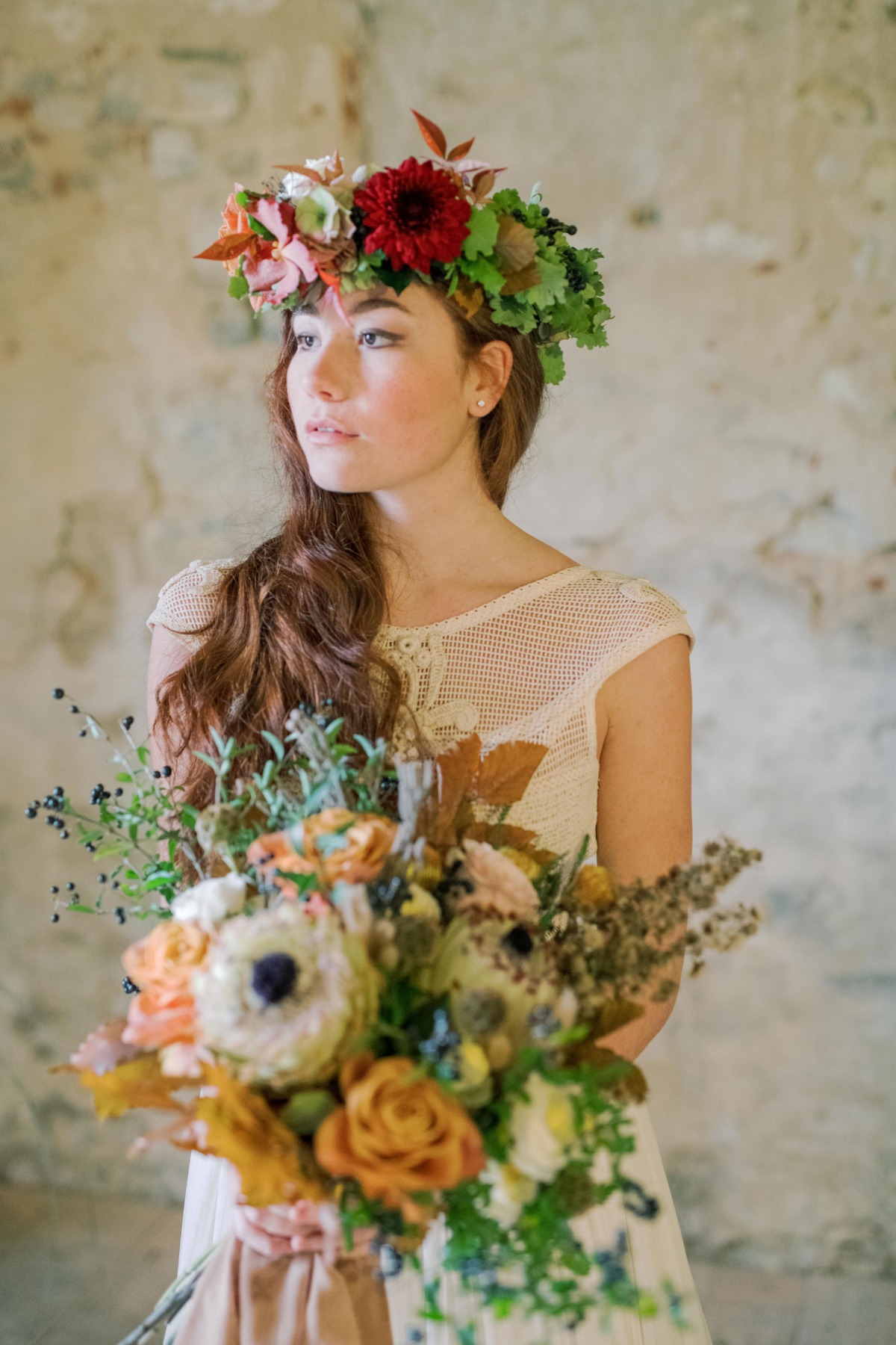 Bride with floral crown and bouquet, autumn wedding inspiration
