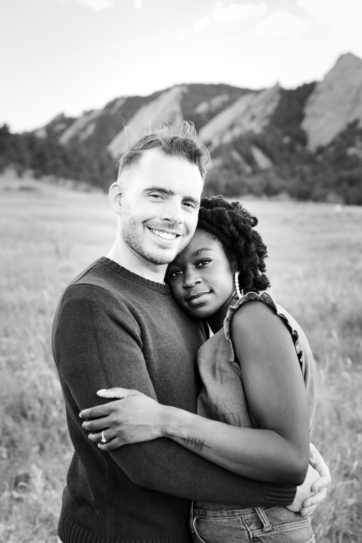 Happy interracial couple embracing outdoors
