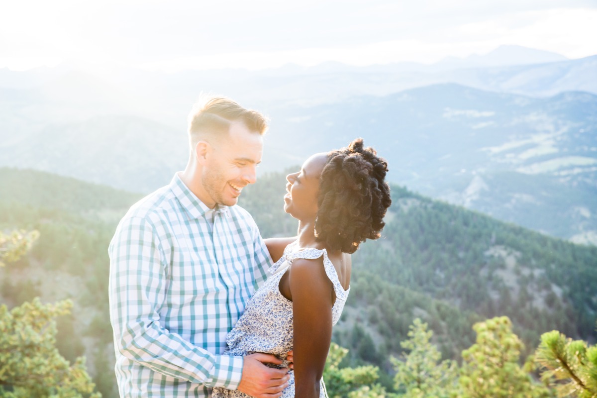 Happy couple embracing in mountain scenery