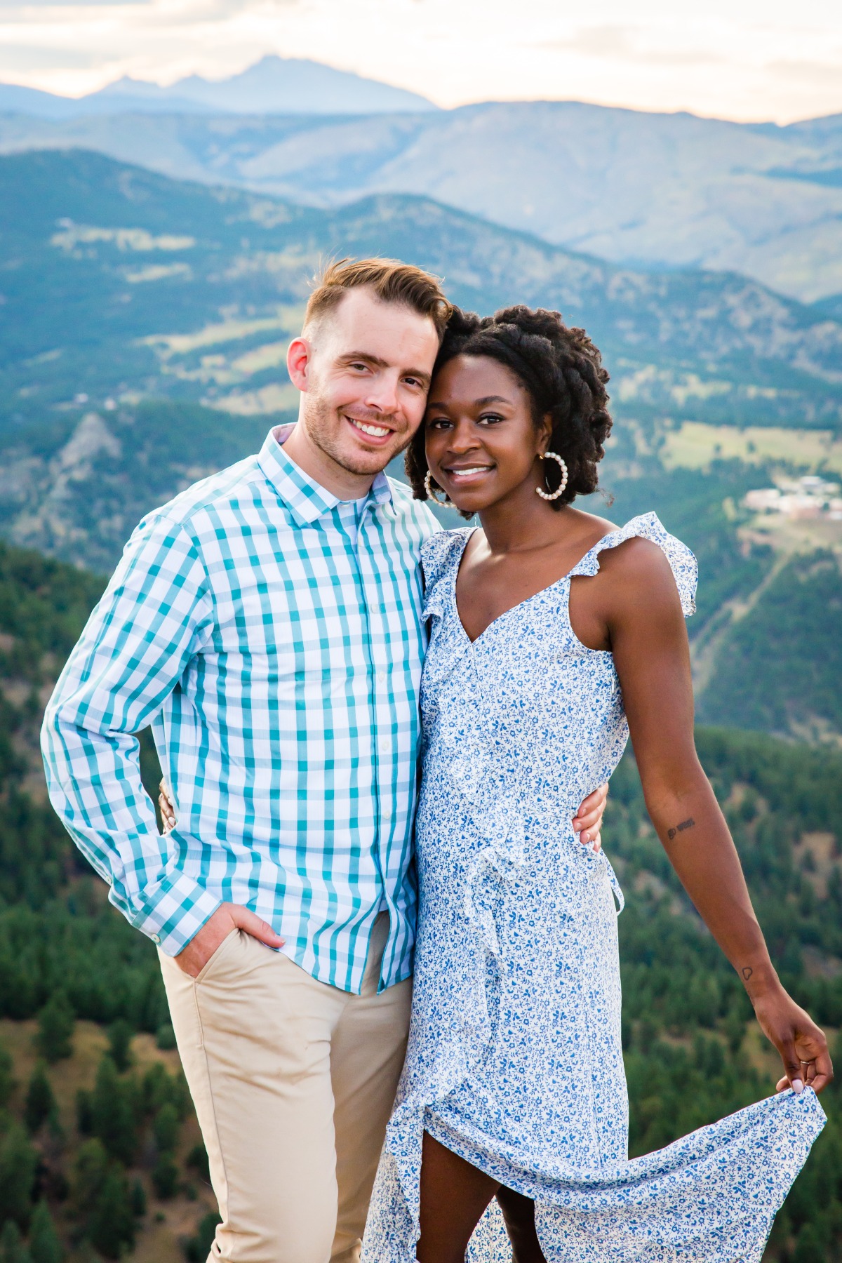 Happy couple posing in mountain scenery