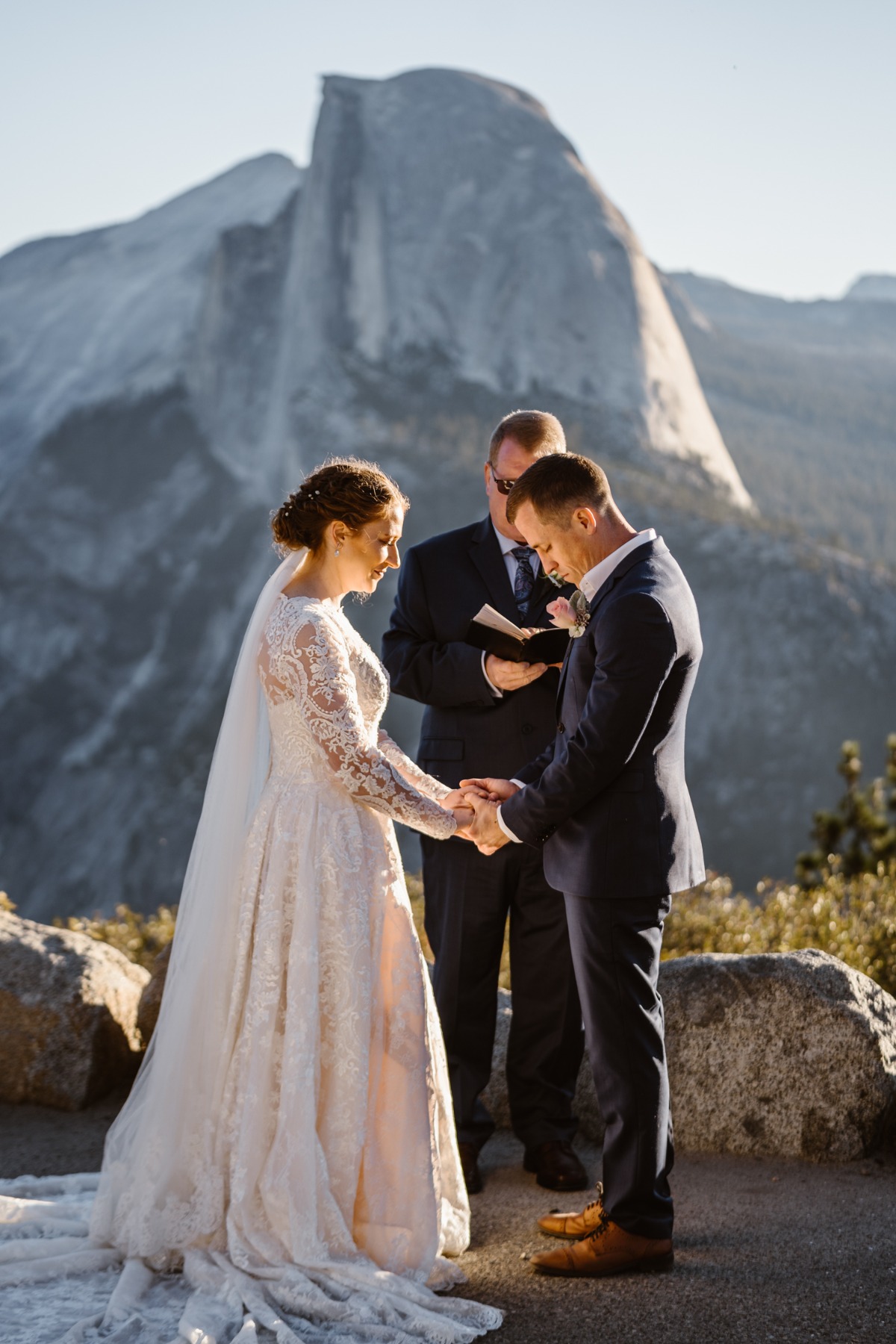 Bride and groom wed outdoors with Half Dome backdrop